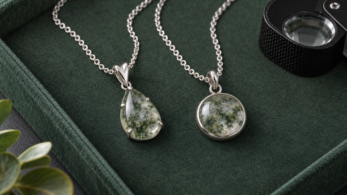 Illustrative silver-tone necklaces with green-patterned stones on dark green fabric beside a loupe; not verified depictions of listed products, moss agate or their materials.
