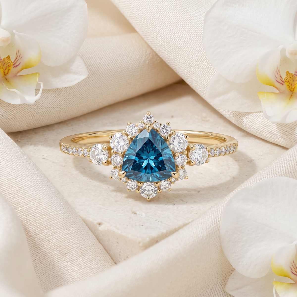 Yellow gold halo engagement ring featuring a trillion-cut blue moissanite center stone.