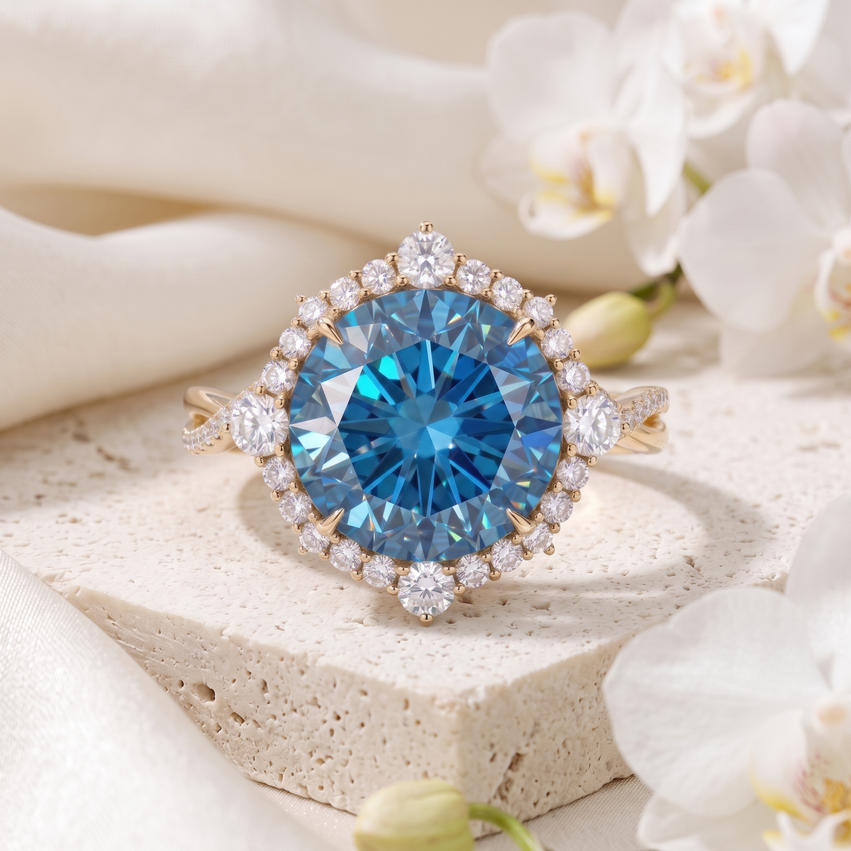 Front view of a yellow gold halo ring featuring a brilliant round-cut blue moissanite center stone.