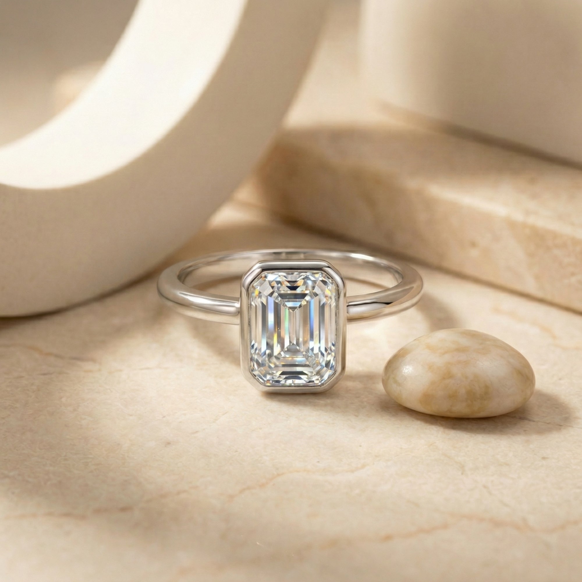 The Astrid Emerald Cut Bezel Ring