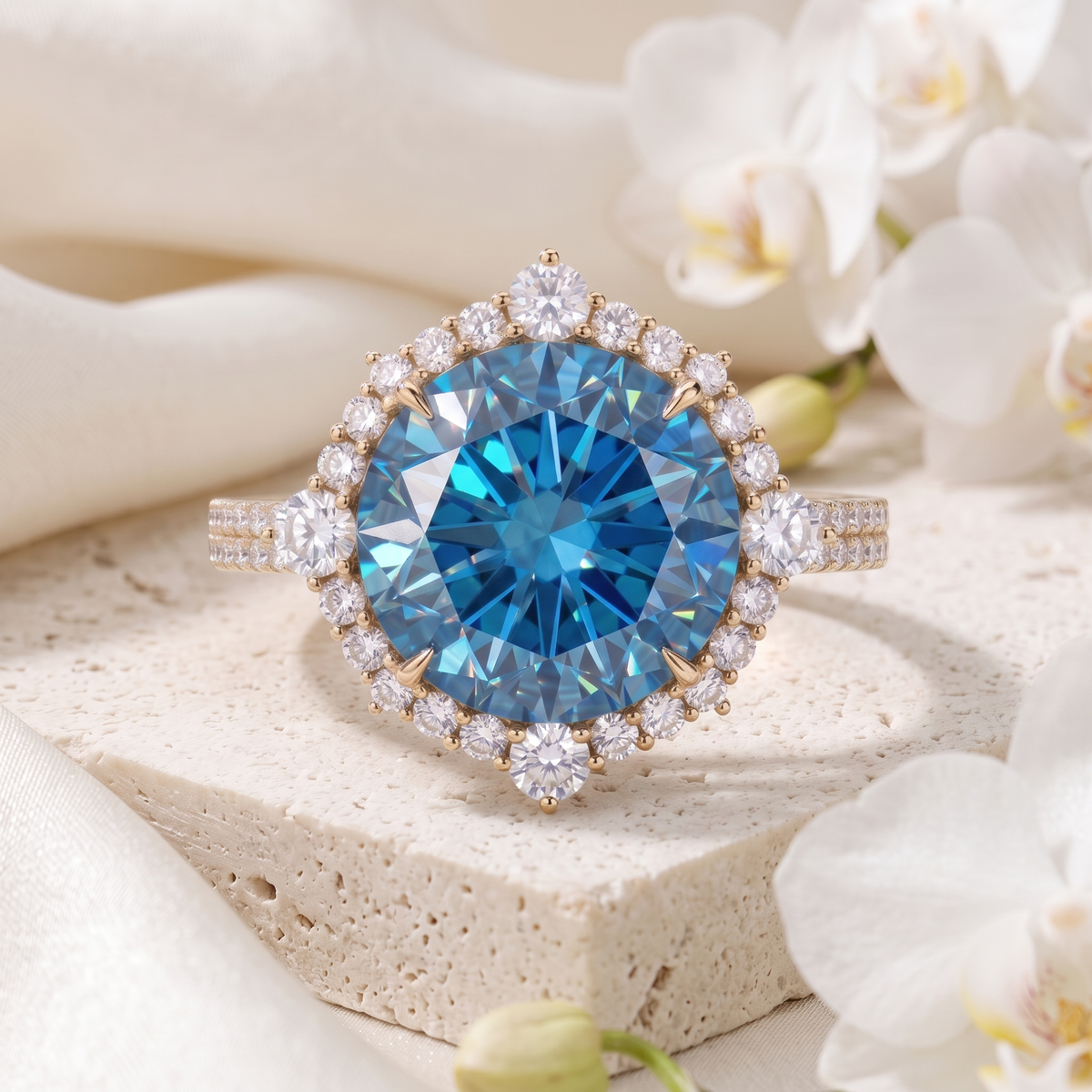 Round brilliant cut blue moissanite halo engagement ring in yellow gold.