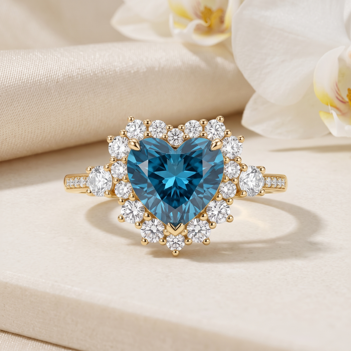 Front view of a heart-shaped blue moissanite halo ring in yellow gold.