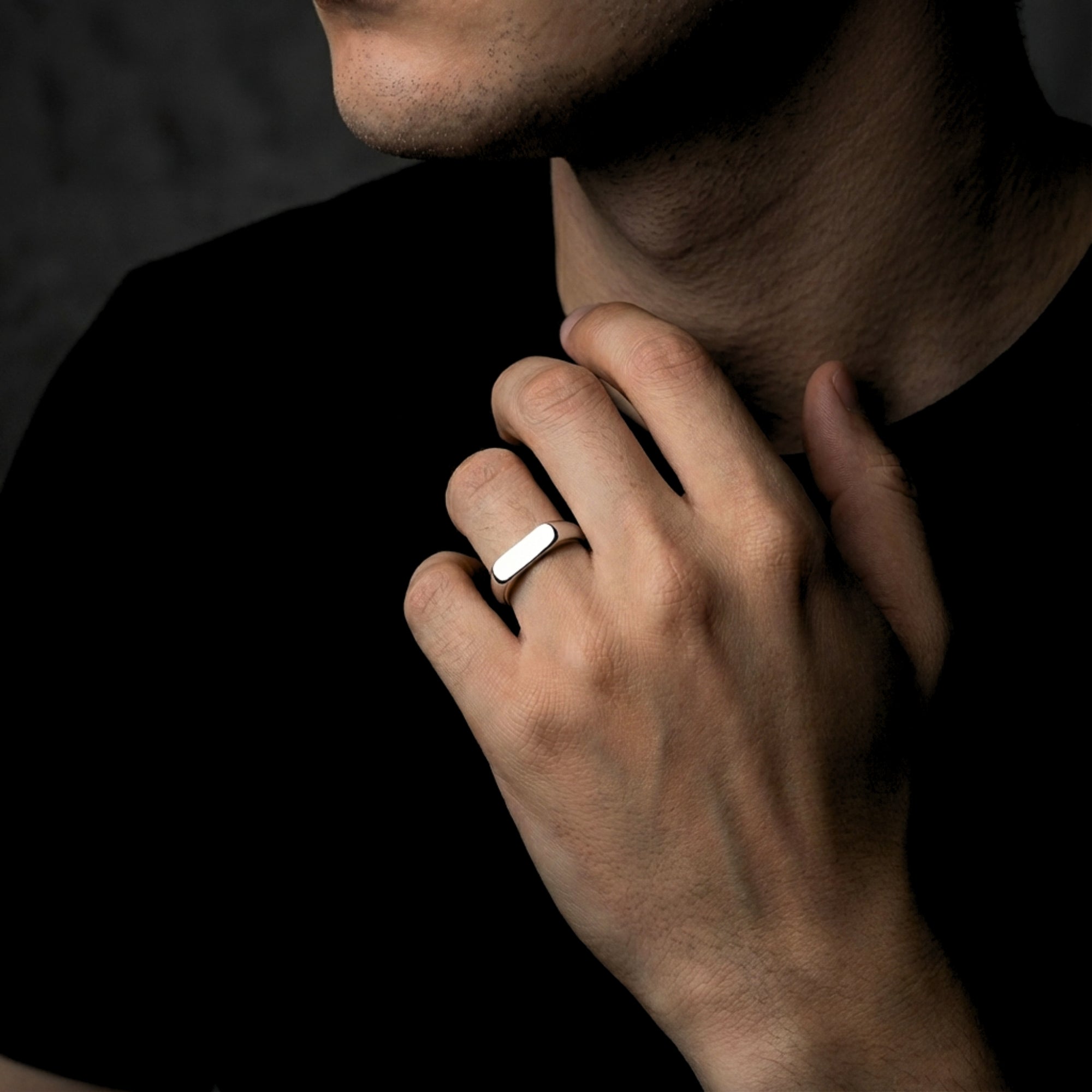 Man wearing the silver Spartan signet ring in stainless steel on his ring finger.