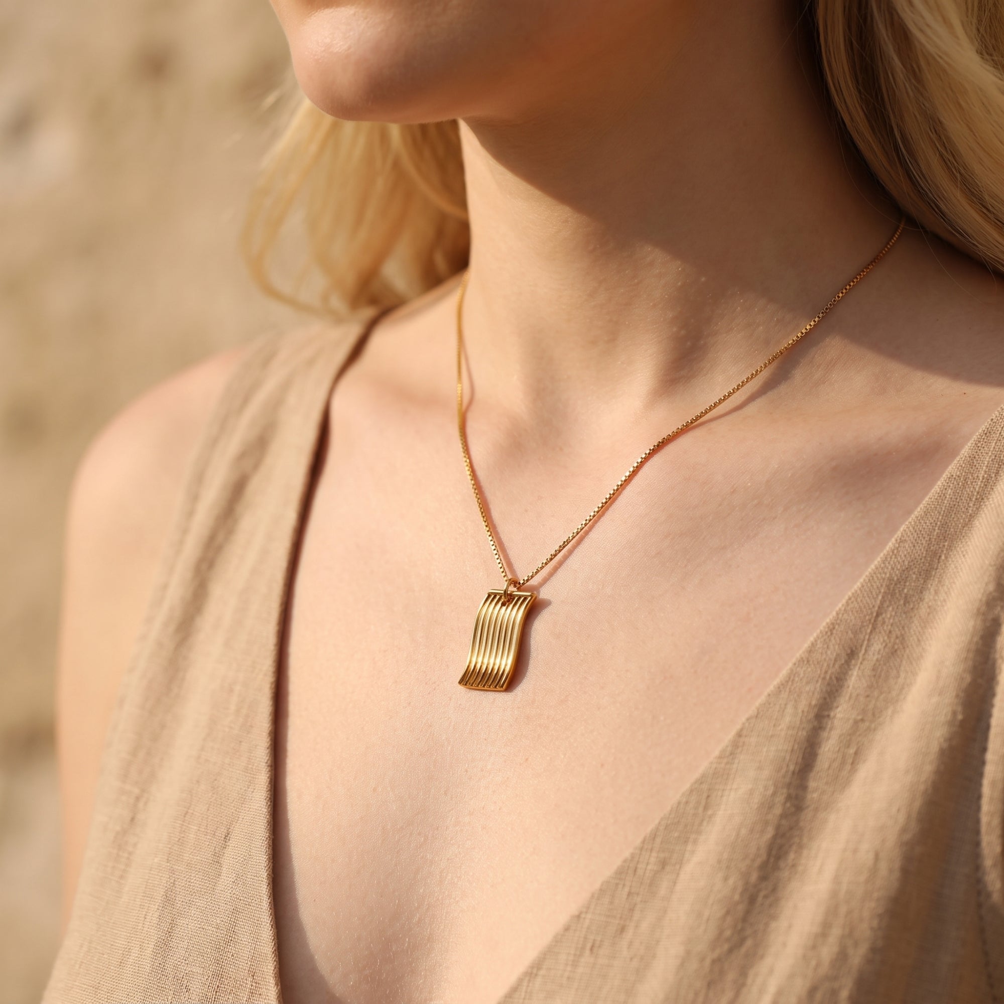 The Fluid Wave Pendant Necklace