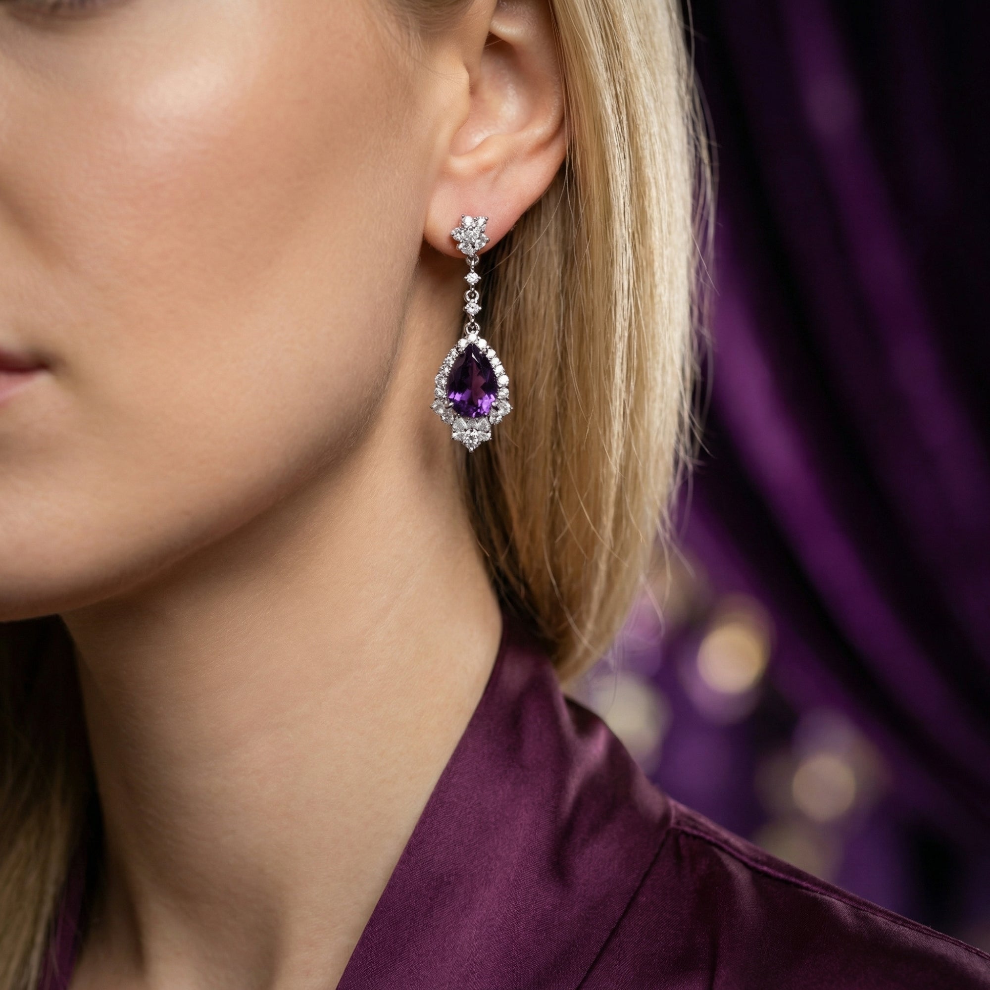 Model wearing a pear cut natural amethyst drop earring in S925 sterling silver.