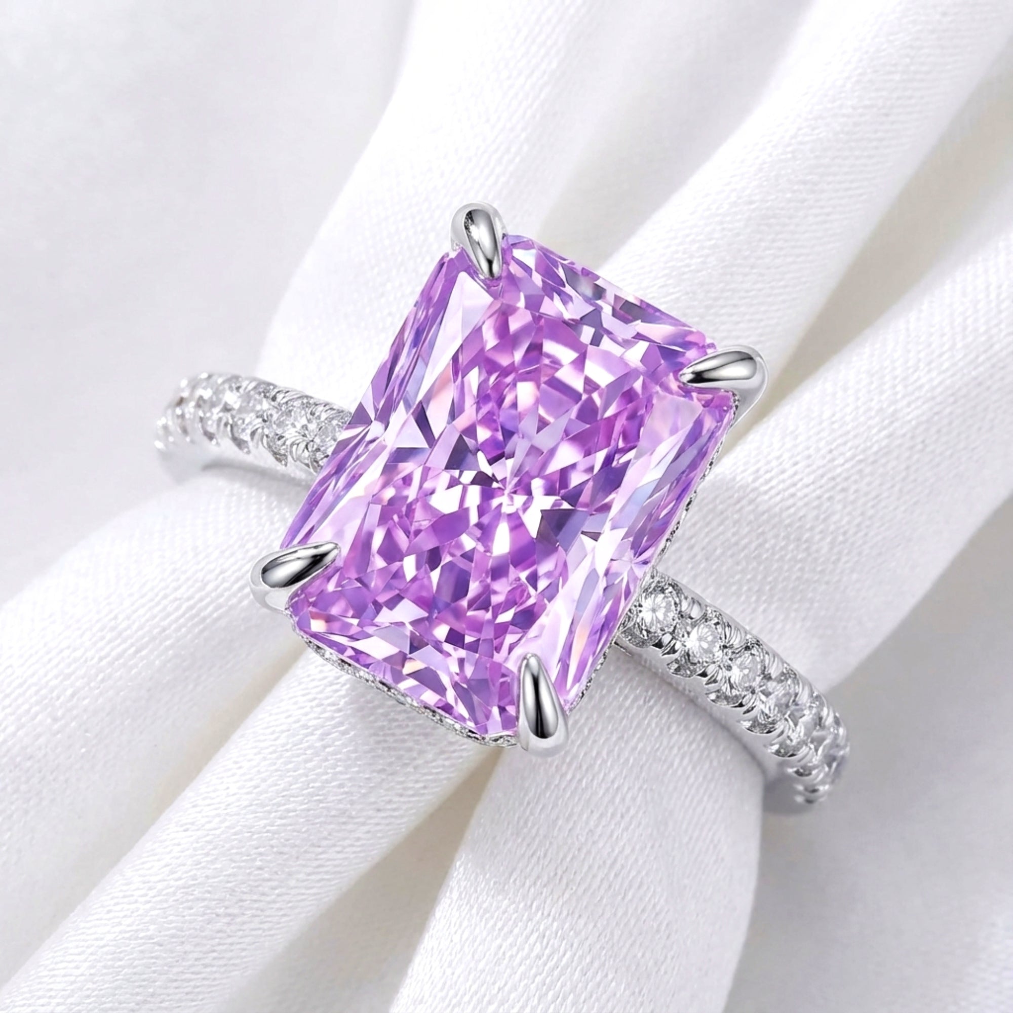 Close-up of a radiant cut purple simulated amethyst ring with a pavé S925 sterling silver band.