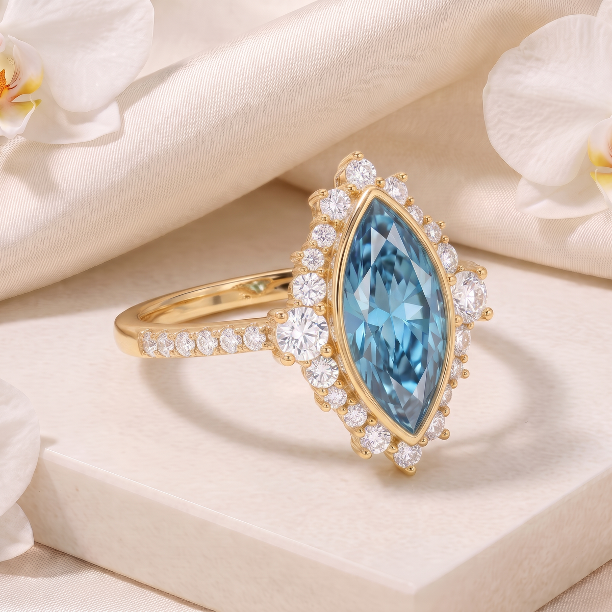 Angled perspective view of a yellow gold marquise-cut blue stone ring accented with a sparkling halo and diamond-set band.