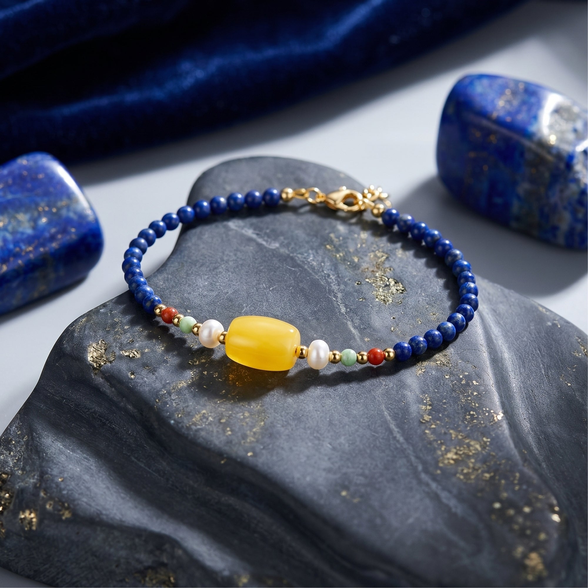 Macro view of the Azure Melody bracelet's 2.8mm lapis lazuli beads and yellow barrel gemstone.