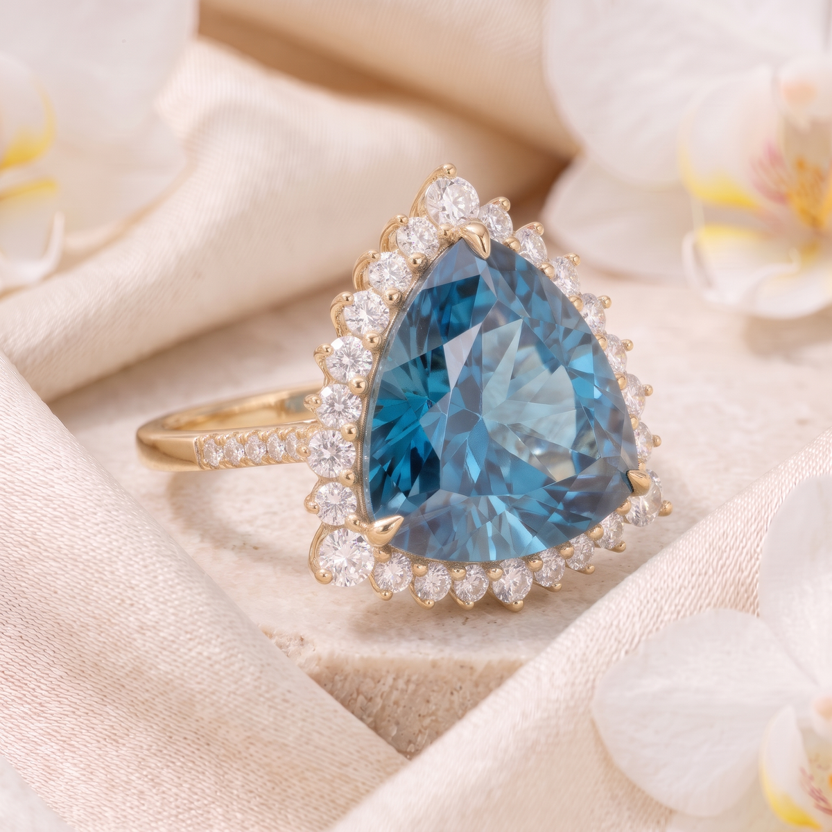 Angled side view of a trillion-cut blue moissanite halo ring in yellow gold.