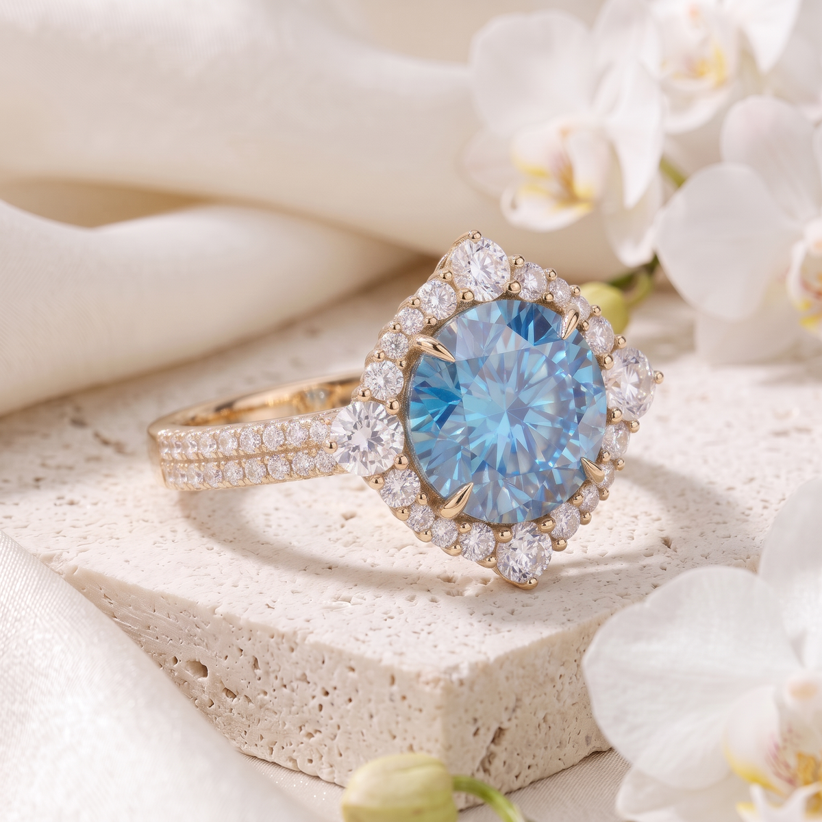 Angled perspective view of round blue moissanite engagement ring with diamond halo in yellow gold