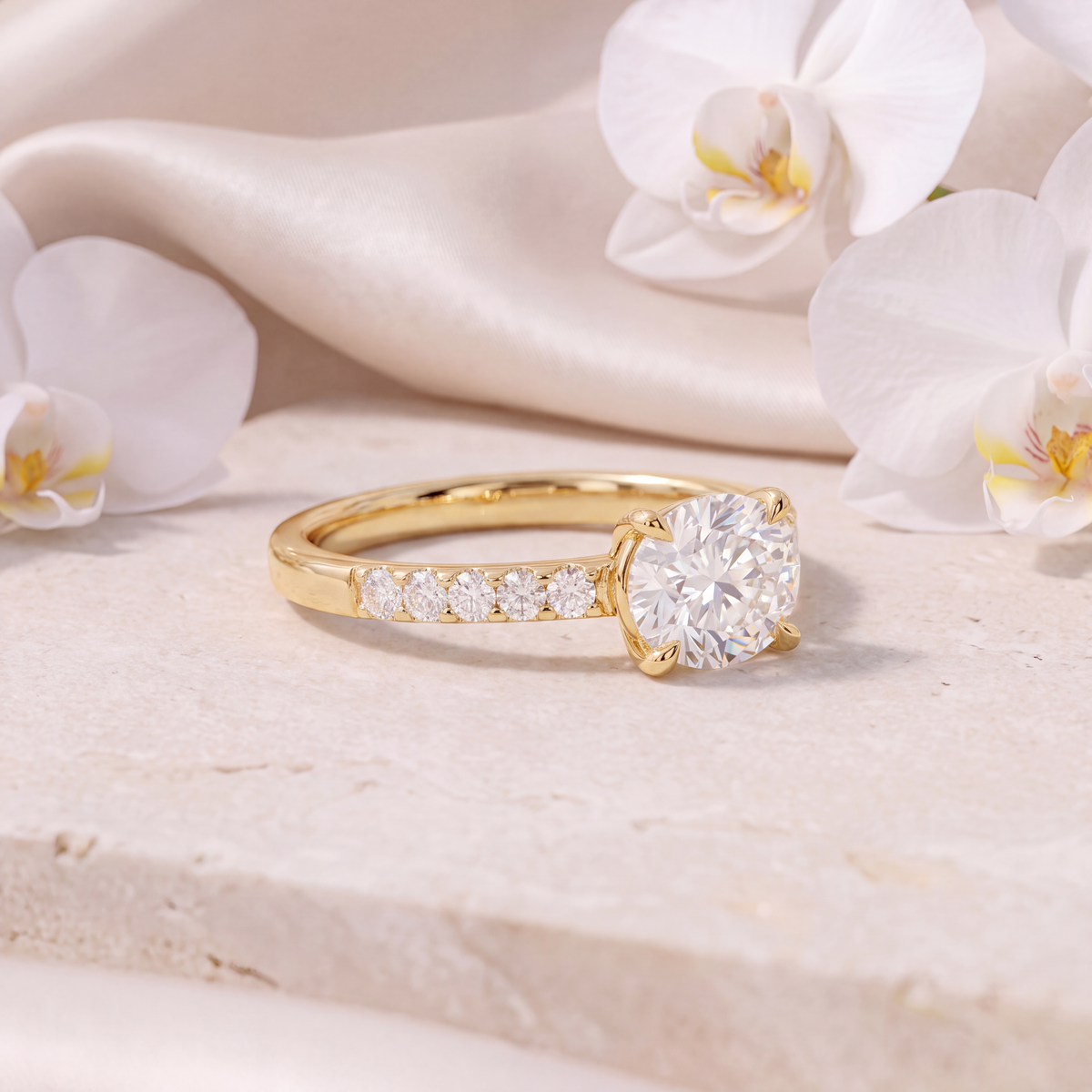 Side view of a gold moissanite engagement ring featuring a round center stone and pave band.