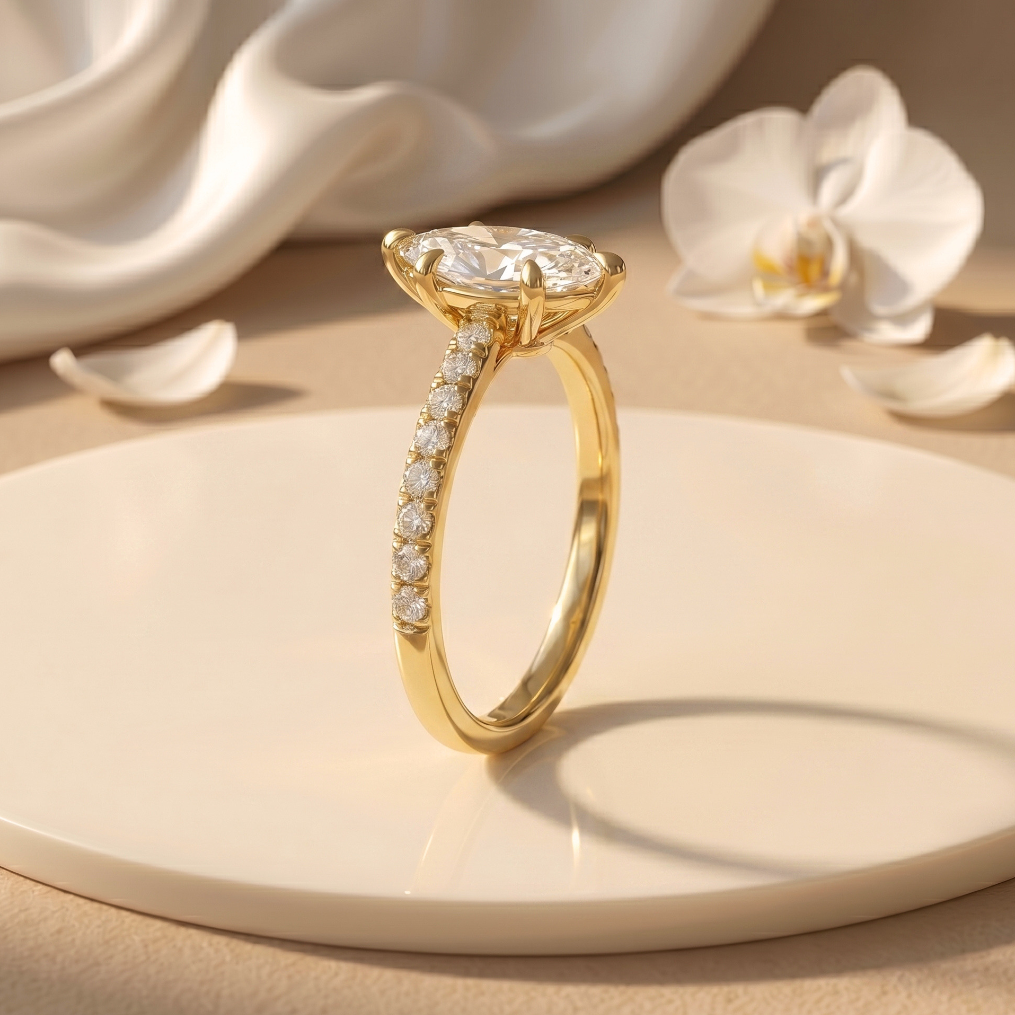 Side profile of a yellow gold marquise-cut moissanite engagement ring, showcasing the basket setting and pavé band details.