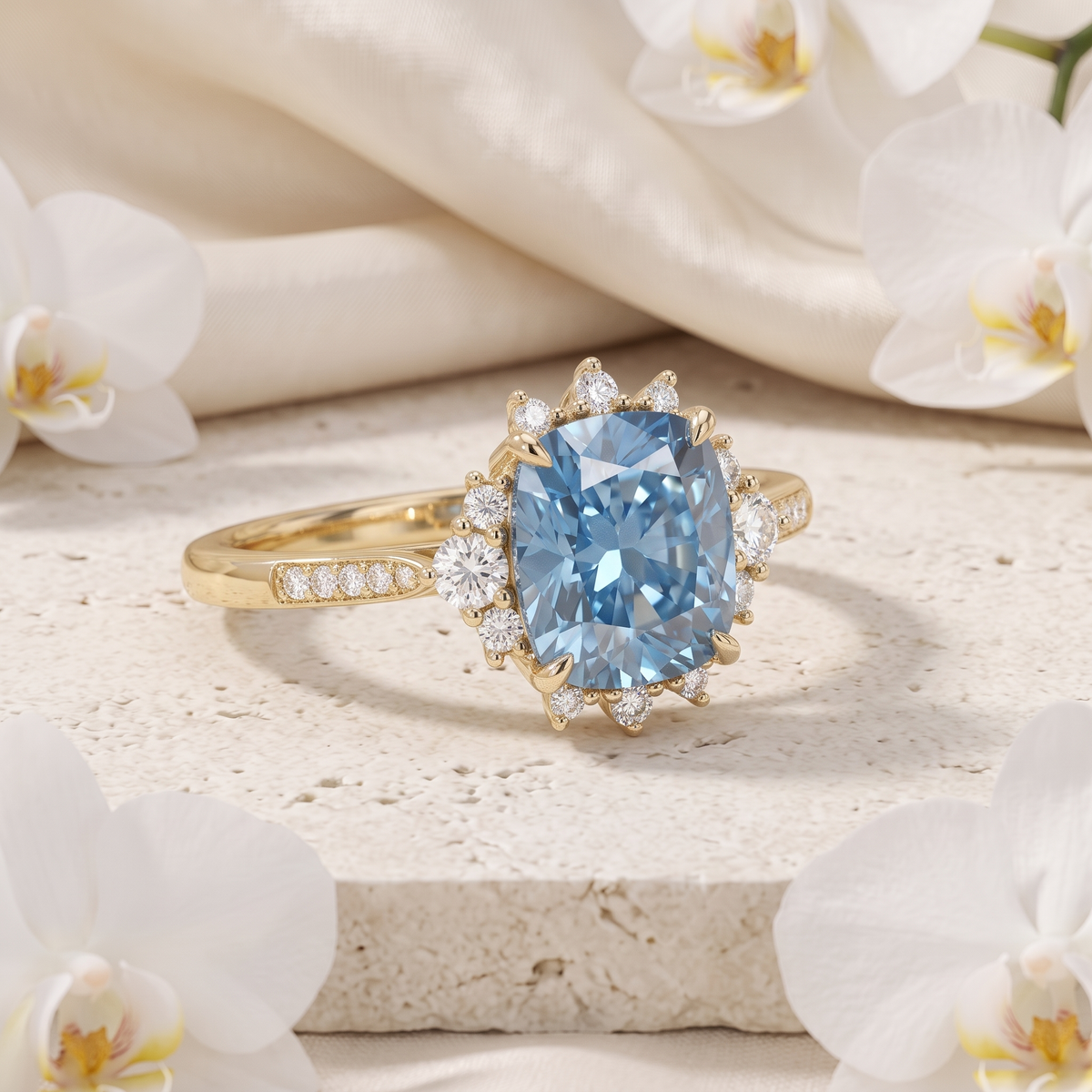 Side-angled view of a yellow gold blue moissanite ring with a diamond halo on a stone slab.