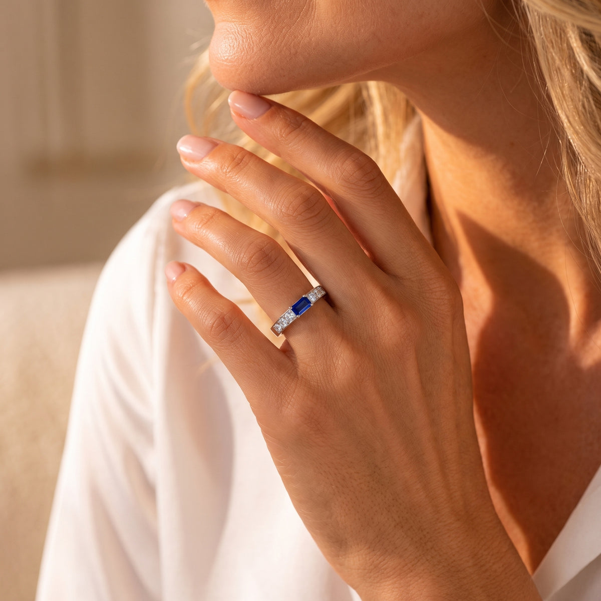 Silver Cherished Memorial Ring worn on a hand with a blue simulated birthstone