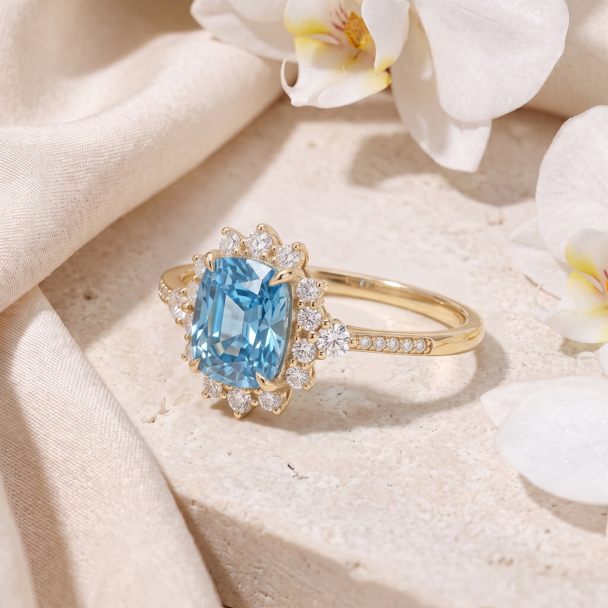Angled view of the yellow gold halo ring featuring a blue cushion-cut central gem.