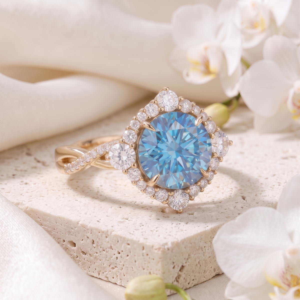 Angled view of the yellow gold blue moissanite halo ring resting on a stone display block.