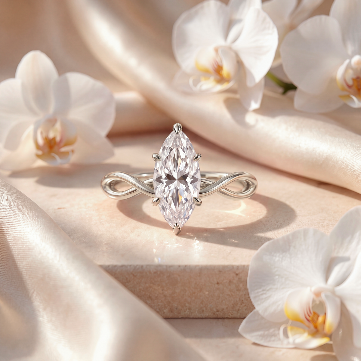 White gold engagement ring with a marquise-cut moissanite stone and a twisted band.