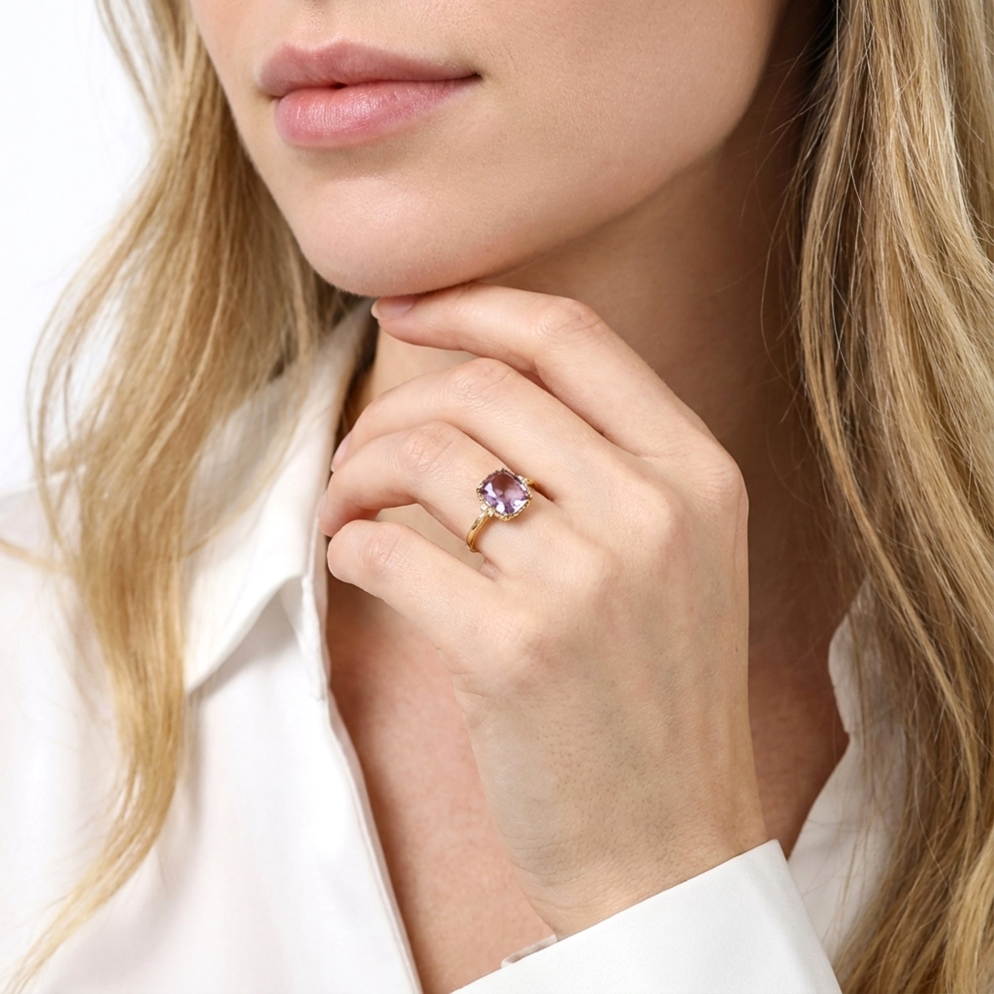 Model wearing the Evora cushion cut simulated amethyst solitaire ring in 18K gold vermeil.