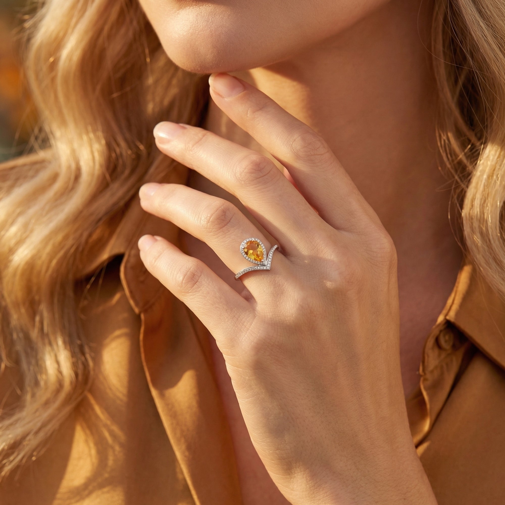 Model wearing the pear cut natural citrine sterling silver ring, paired with an autumn-toned outfit.