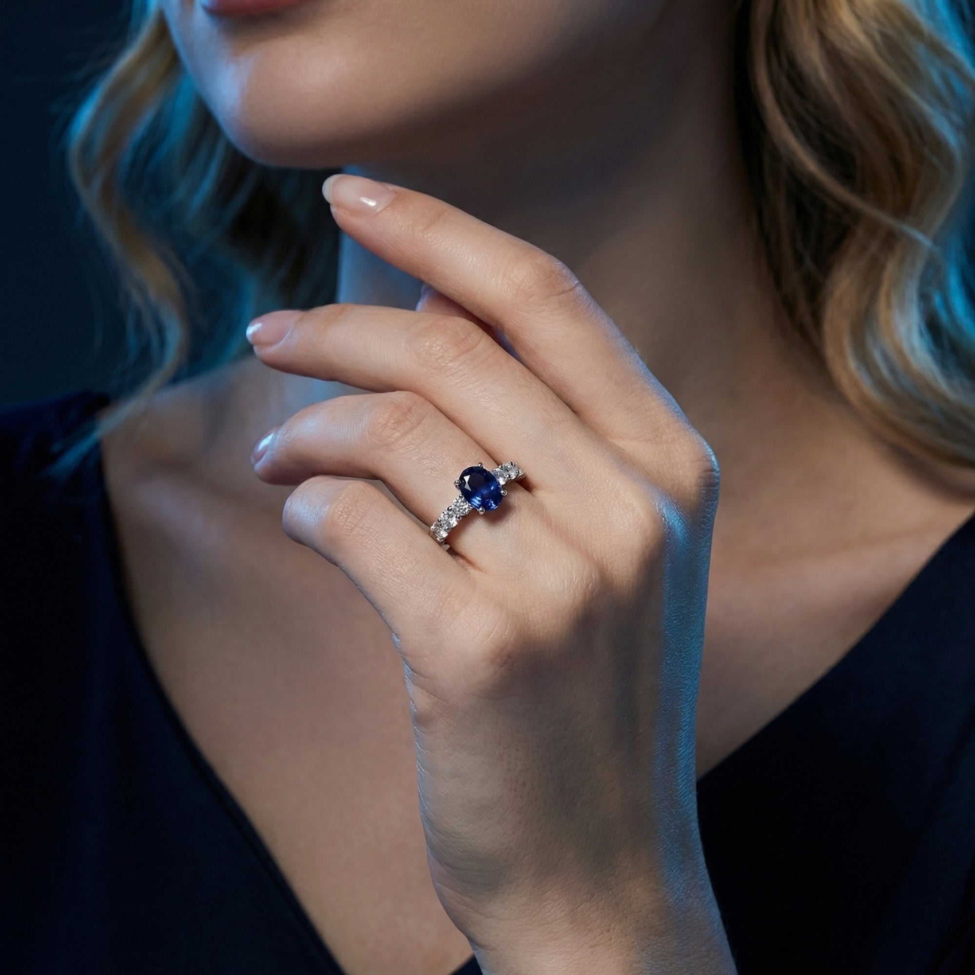 Lifestyle shot of a model wearing the oval natural tanzanite ring in 925 sterling silver.