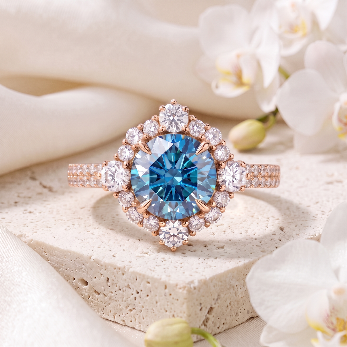 A rose gold halo ring with a round blue moissanite central stone encircled by a starburst diamond halo.