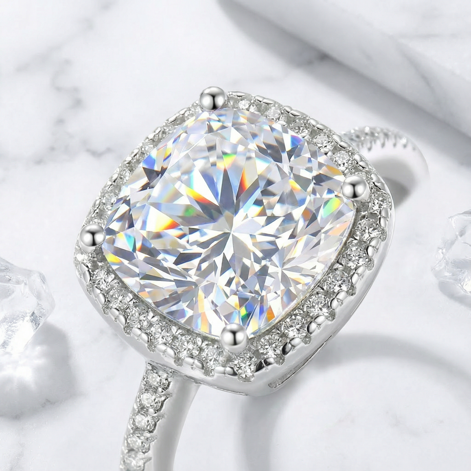 Macro detail of the cushion cut simulated diamond and halo setting on a sterling silver ring.