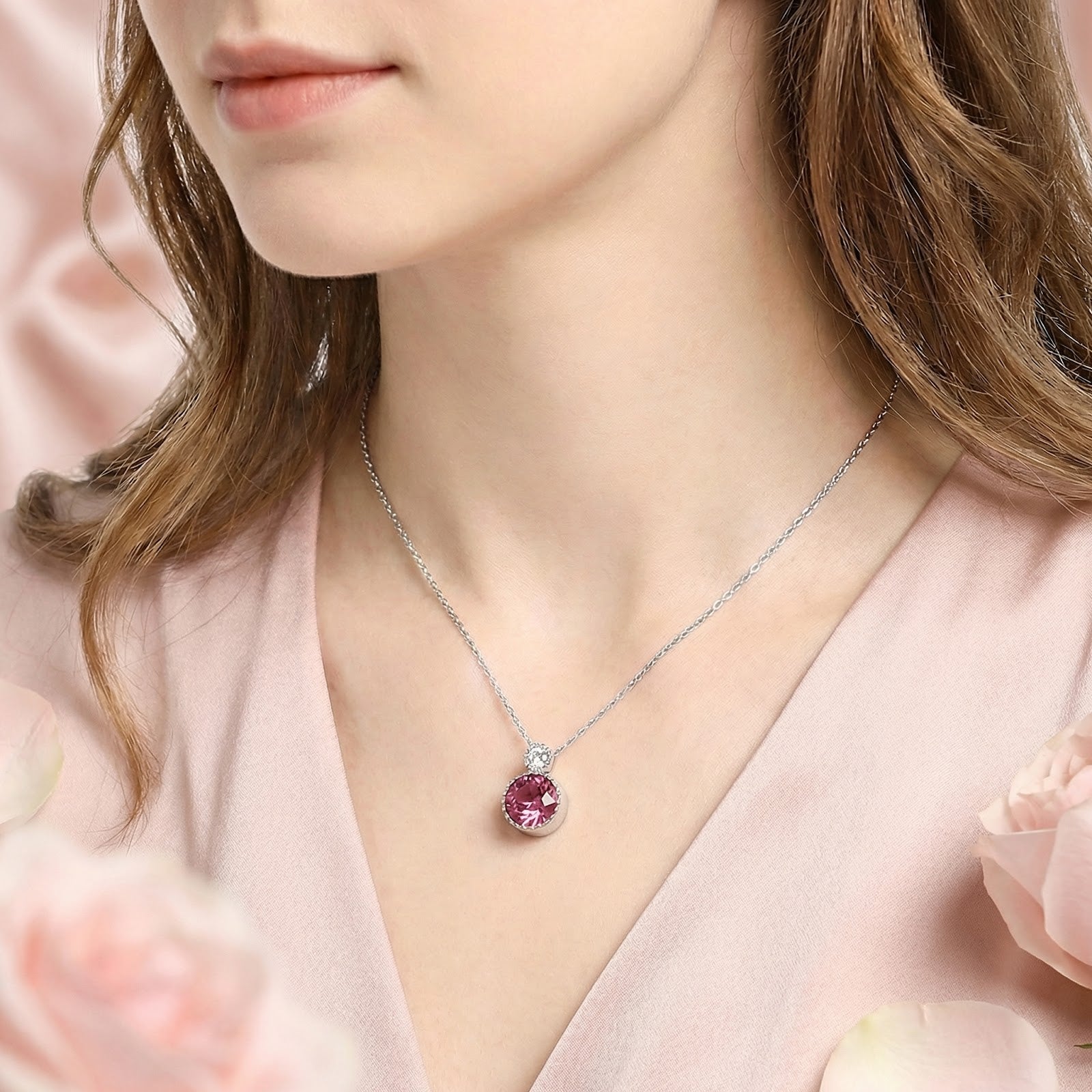 Model wearing the S925 sterling silver Serenielle pendant necklace with a round-cut simulated pink tourmaline.