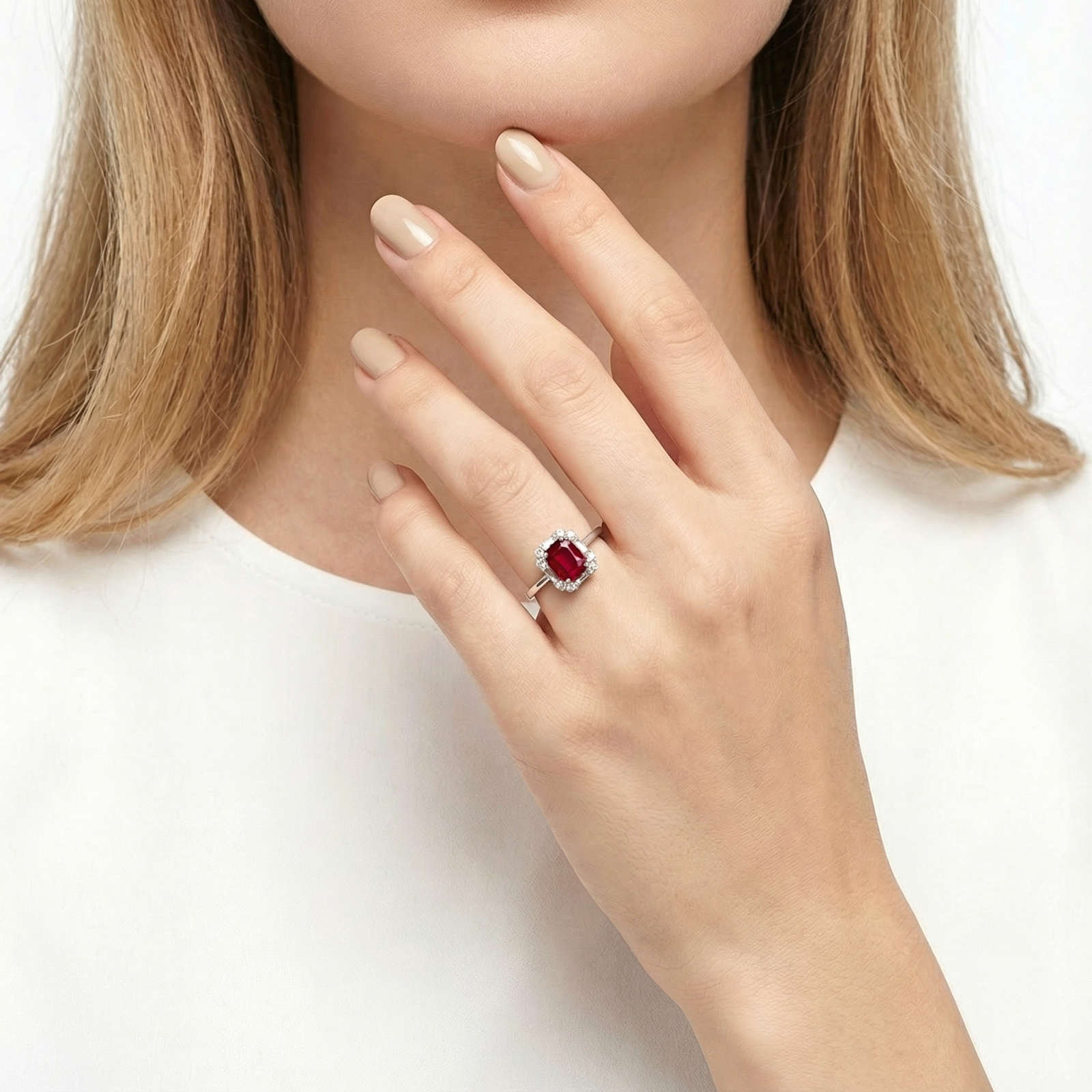 Model wearing the emerald cut simulated ruby ring in sterling silver on her ring finger.