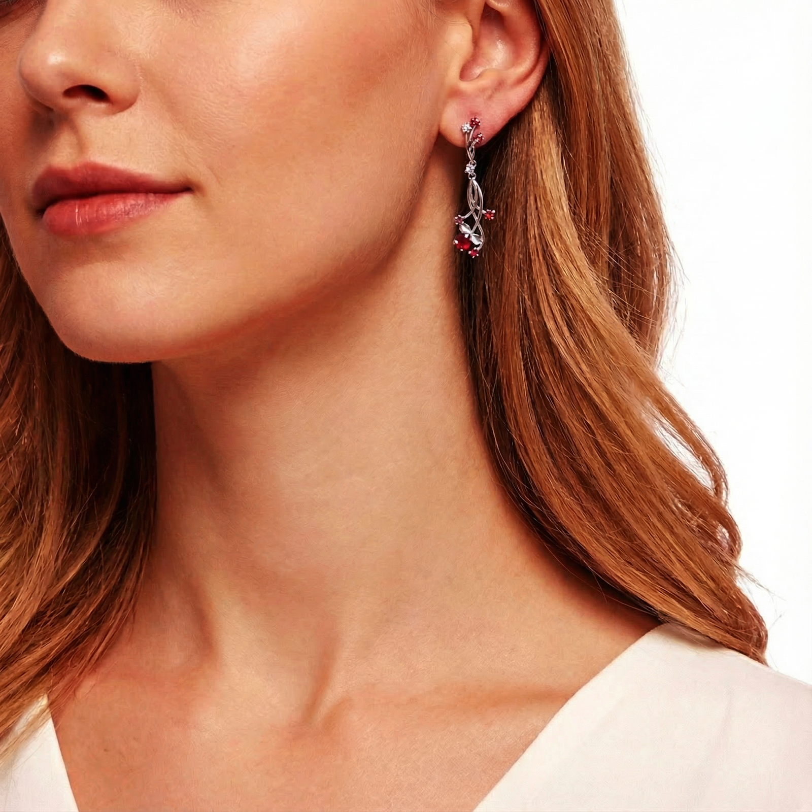 Model wearing a sterling silver Valisara drop earring with pigeon blood red simulated rubies.