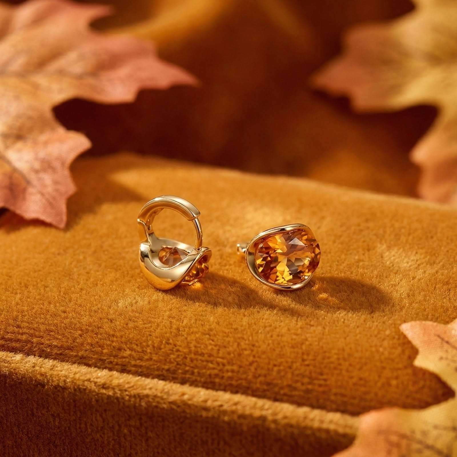 Close-up of oval honeyed topaz stud earrings in 18K gold vermeil showing the secure low-profile setting.