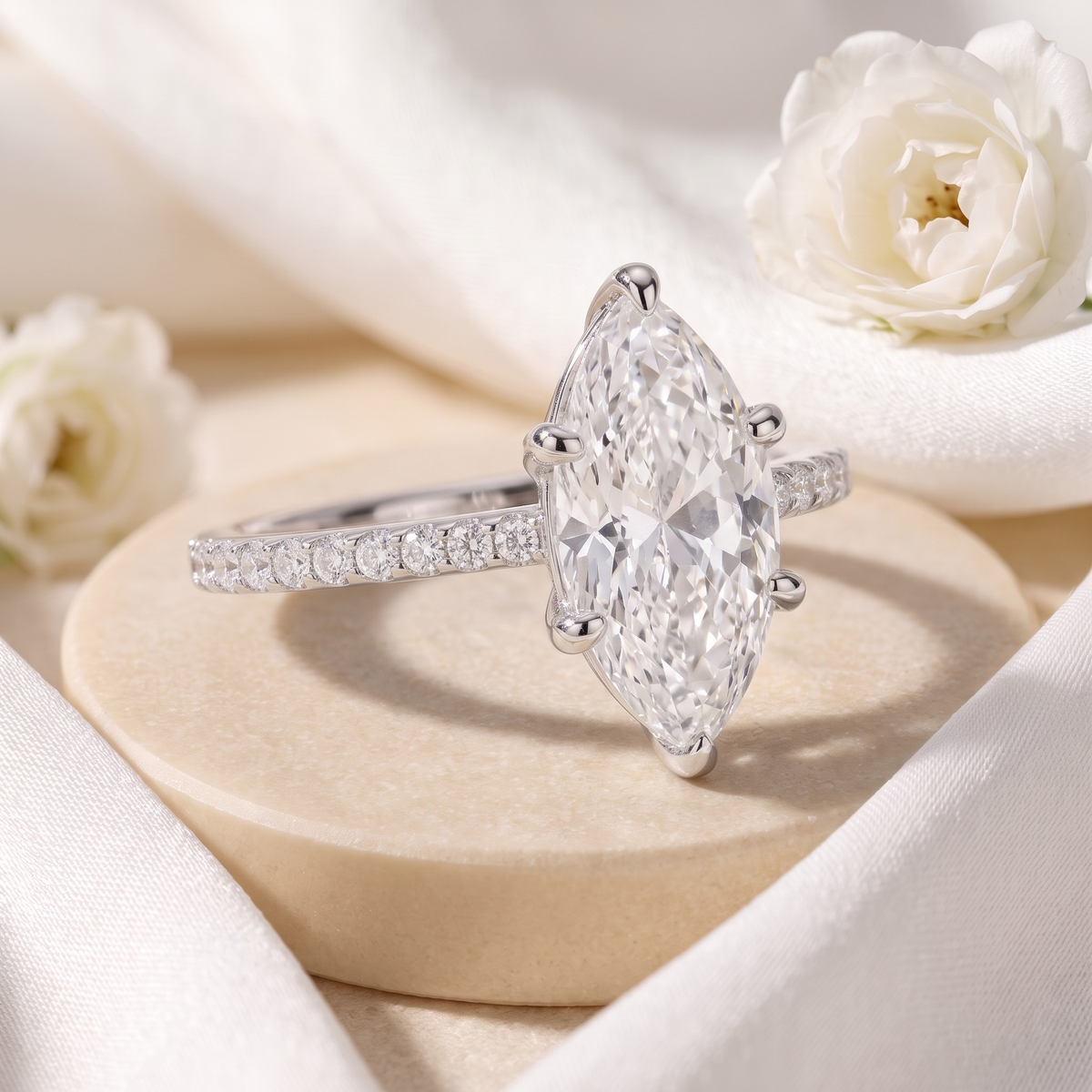 Six-prong marquise moissanite ring in silver, angled closeup.