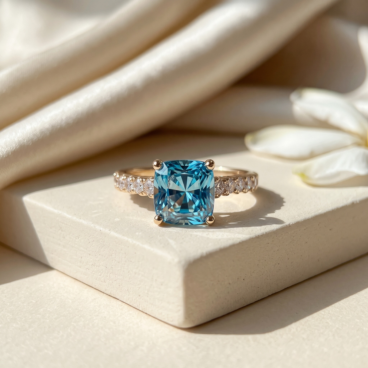 The Juliana Hope blue cushion moissanite ring in yellow gold, isolated product view