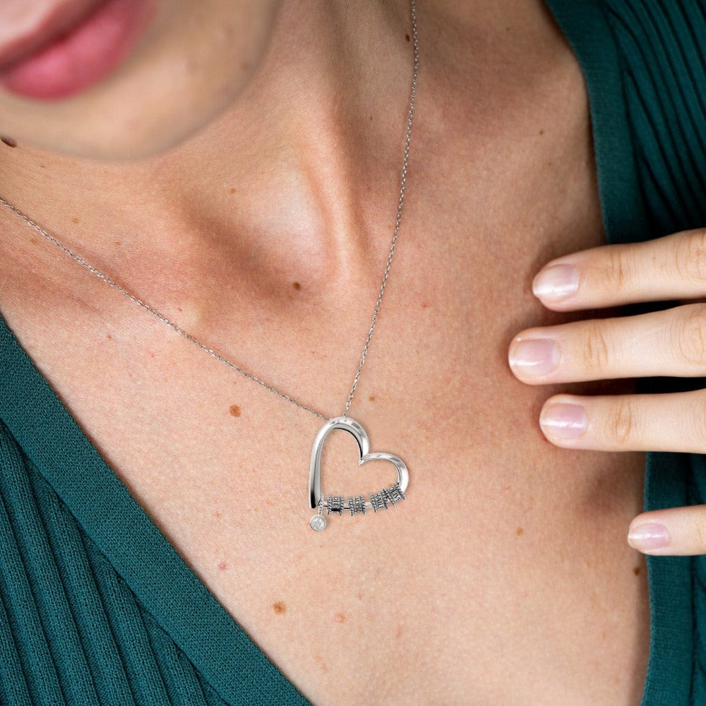 Herzkette mit gravierten Perlen und Diamant