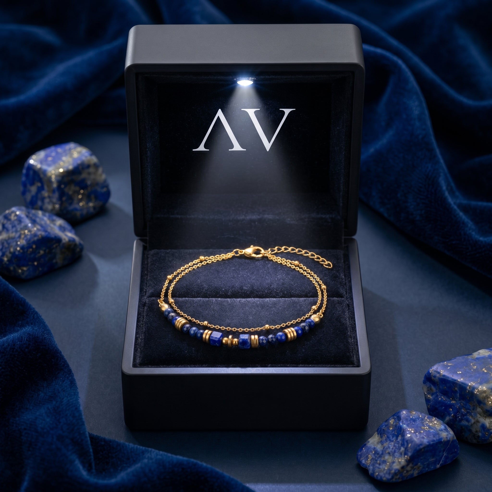 18K gold plated lapis lazuli bracelet inside a premium black LED-lit gift box with raw stones.