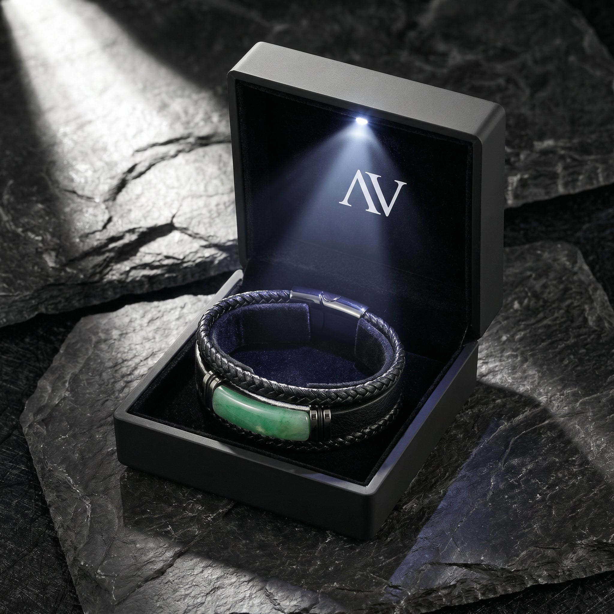 Men's green and black leather bracelet in a black branded gift box with a built-in LED spotlight.