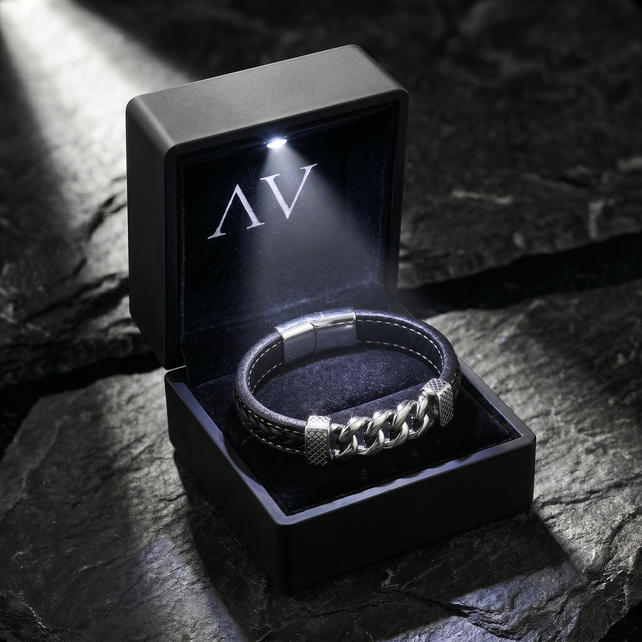 Braided black leather and silver steel bracelet inside a premium black LED-lit gift box with AV branding.