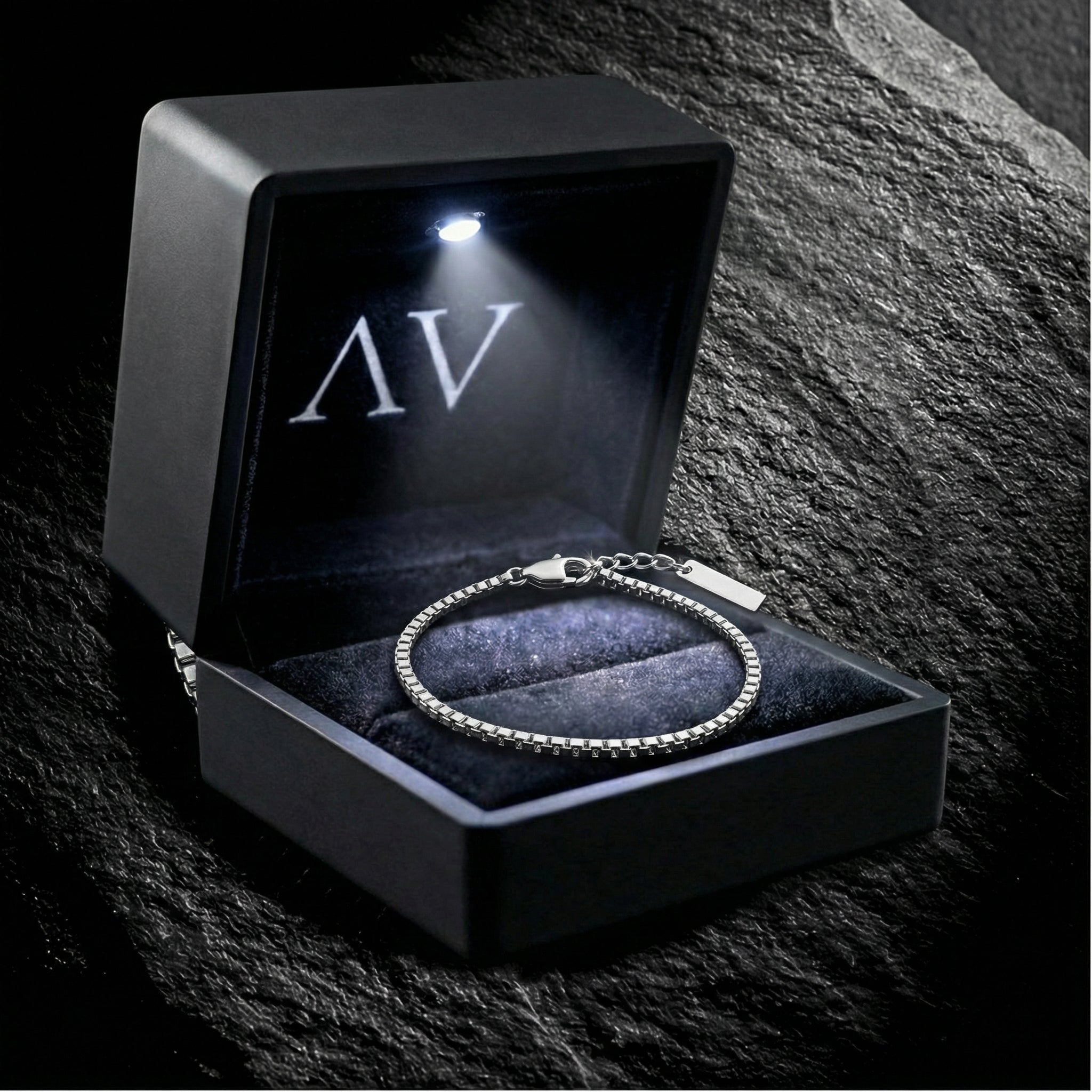 Men's silver box chain bracelet in a premium black lighted gift box with AV branding.