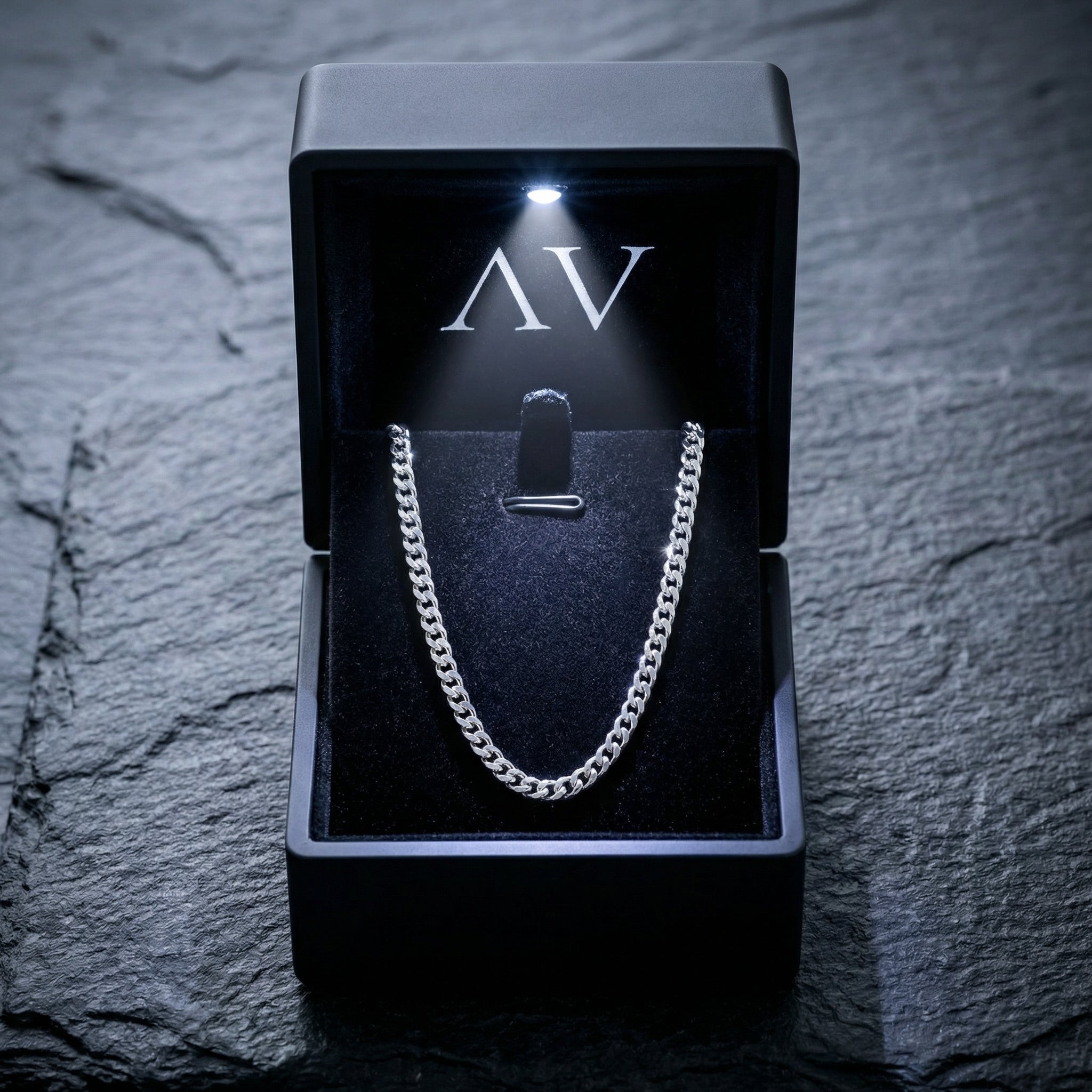 2mm silver stainless steel curb chain presented in a premium black LED-lighted gift box.