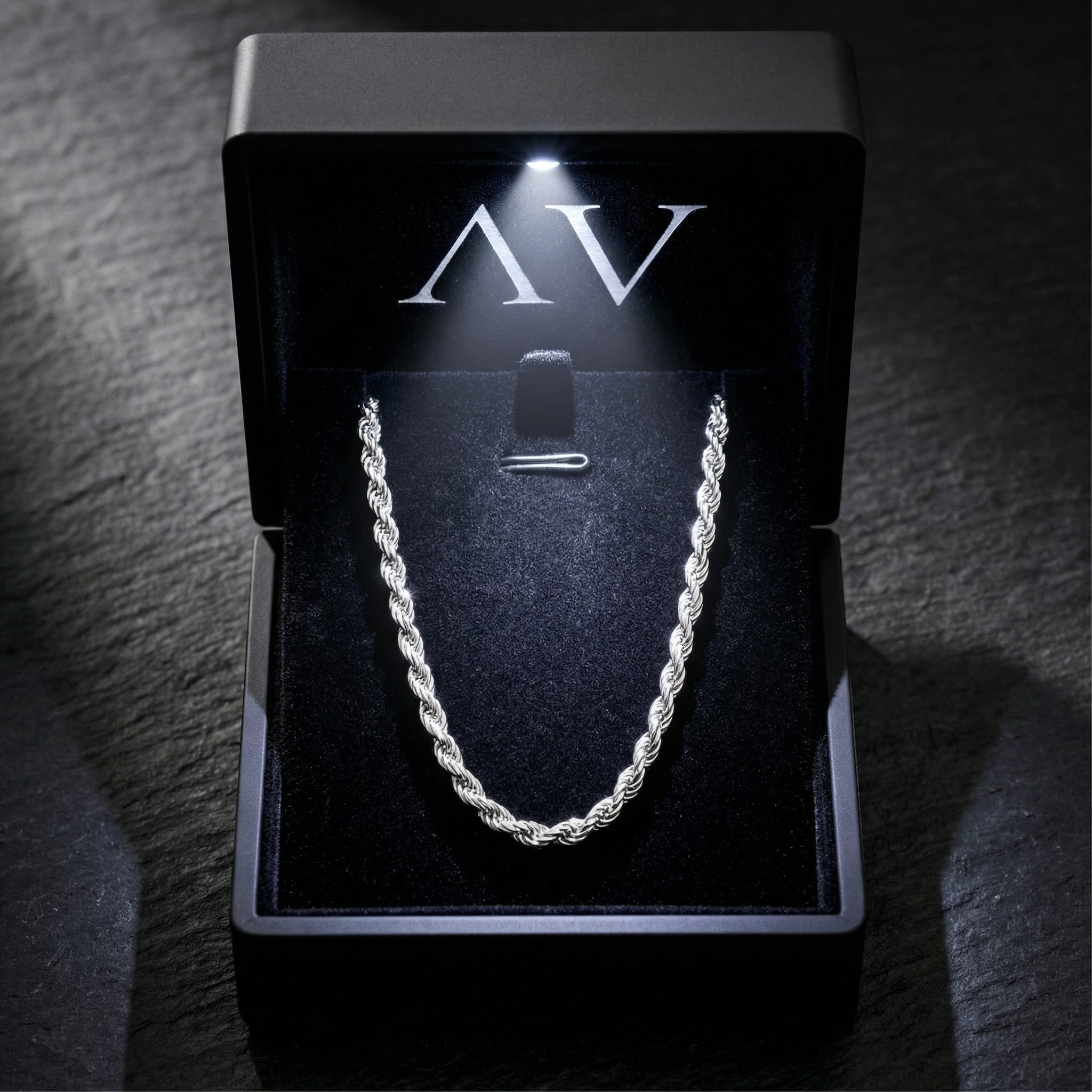 Silver stainless steel rope chain inside a black luxury gift box with a built-in LED light.