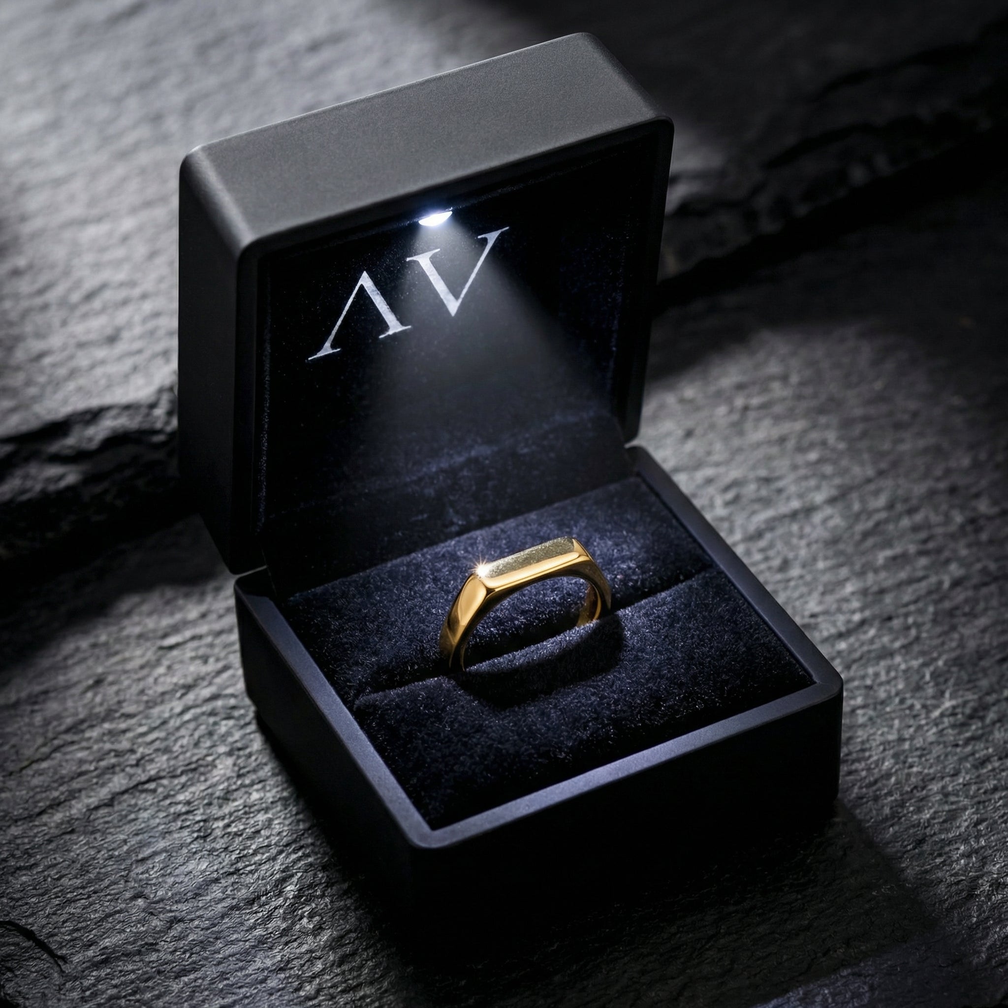 Gold stainless steel Pillar signet ring presented in a black illuminated gift box with a built-in LED light.