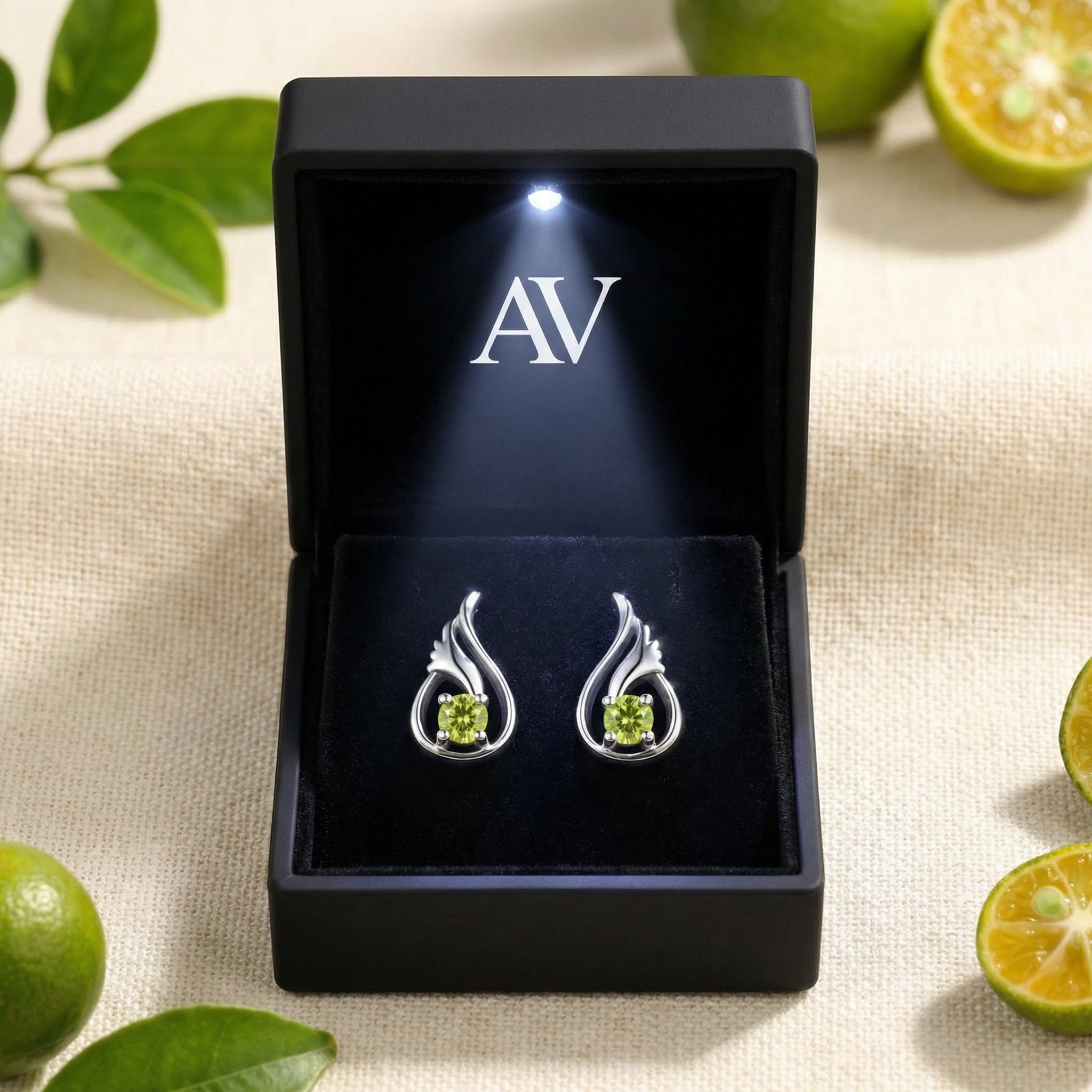 S925 sterling silver tulip bud peridot earrings presented in a black illuminated jewelry box with an AV logo.