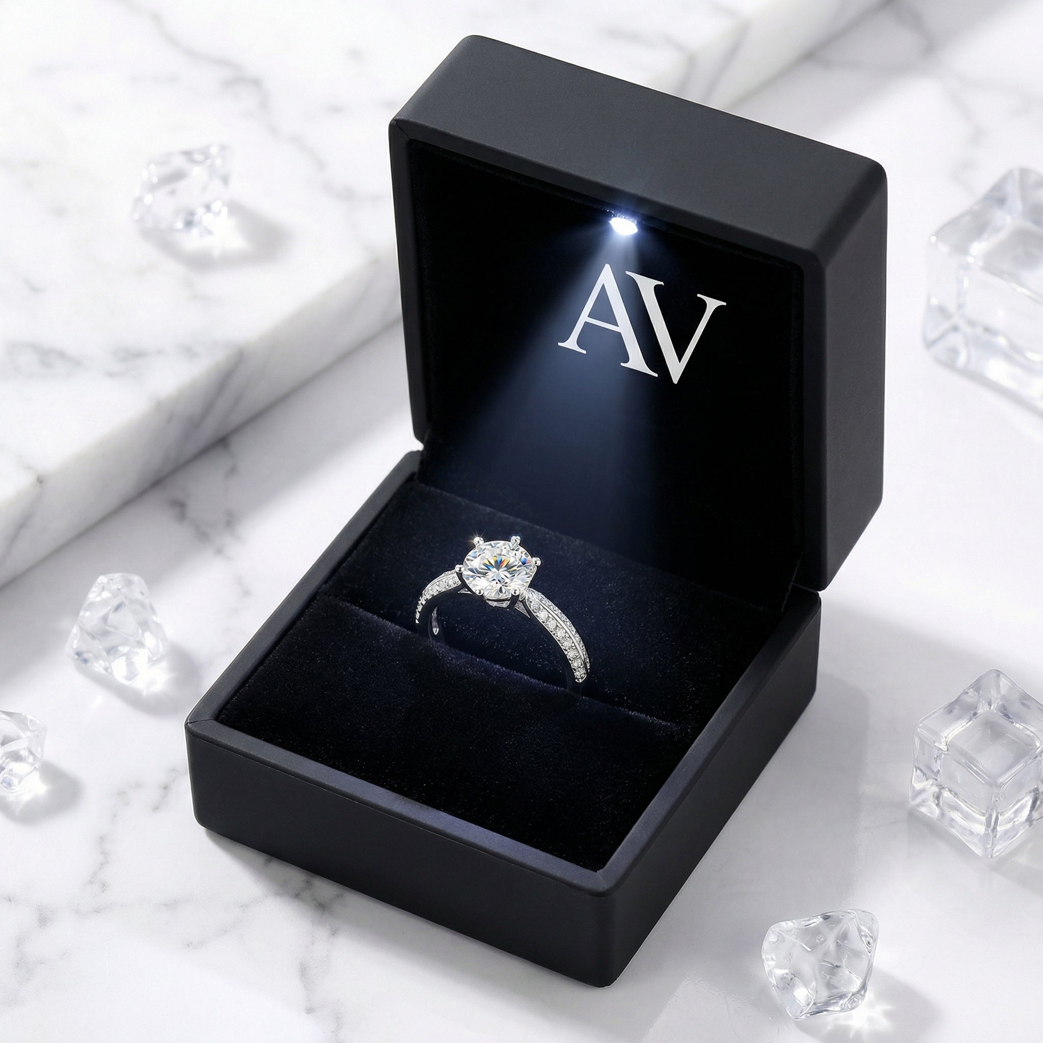 S925 sterling silver round simulated diamond solitaire ring inside a black LED-lighted jewelry gift box.