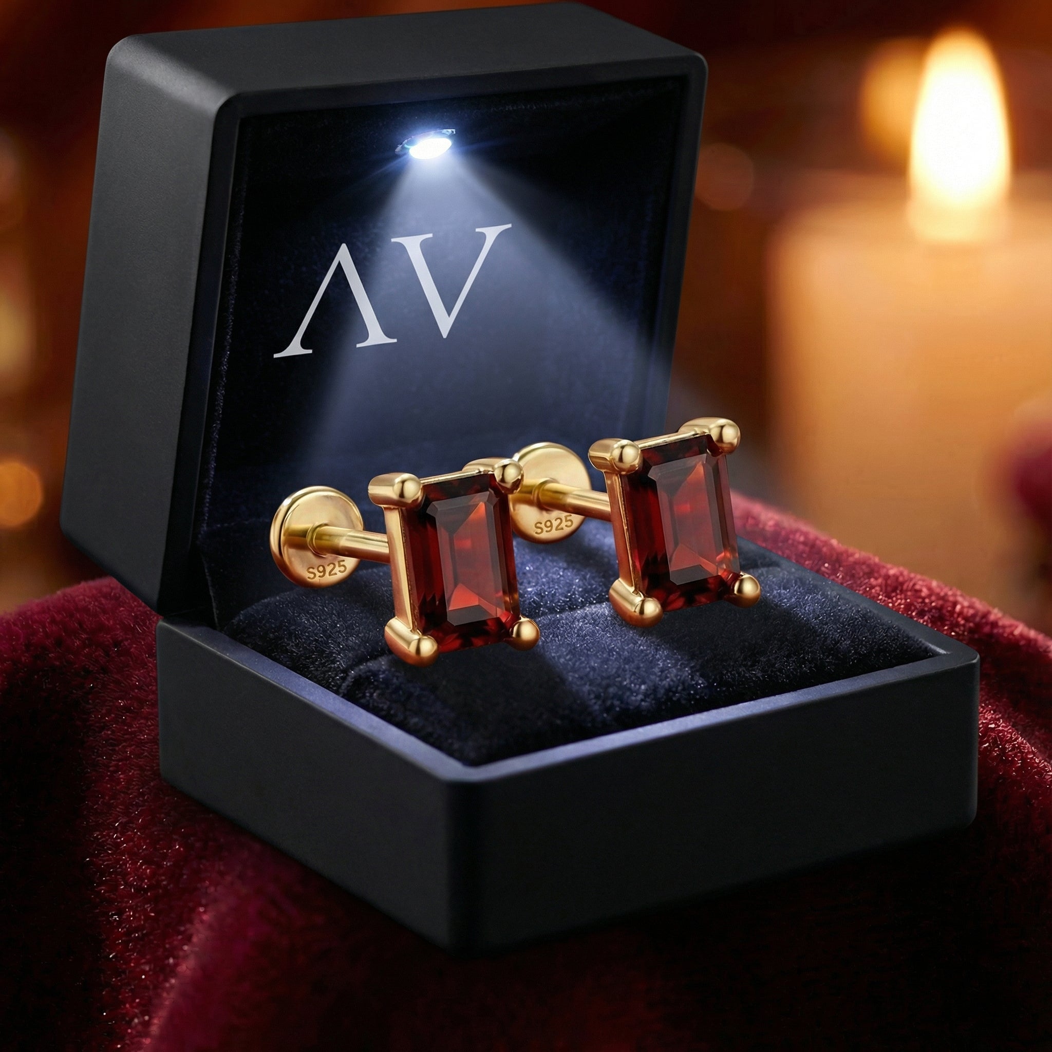 Baguette cut simulated garnet stud earrings in 18K gold vermeil inside a premium lighted black jewelry gift box.
