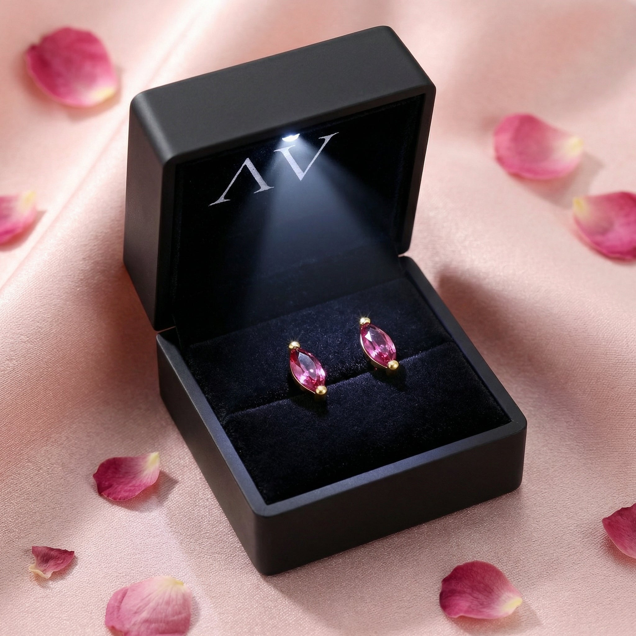 Pink tourmaline marquise earrings in 18K gold vermeil inside a black lighted jewelry gift box.