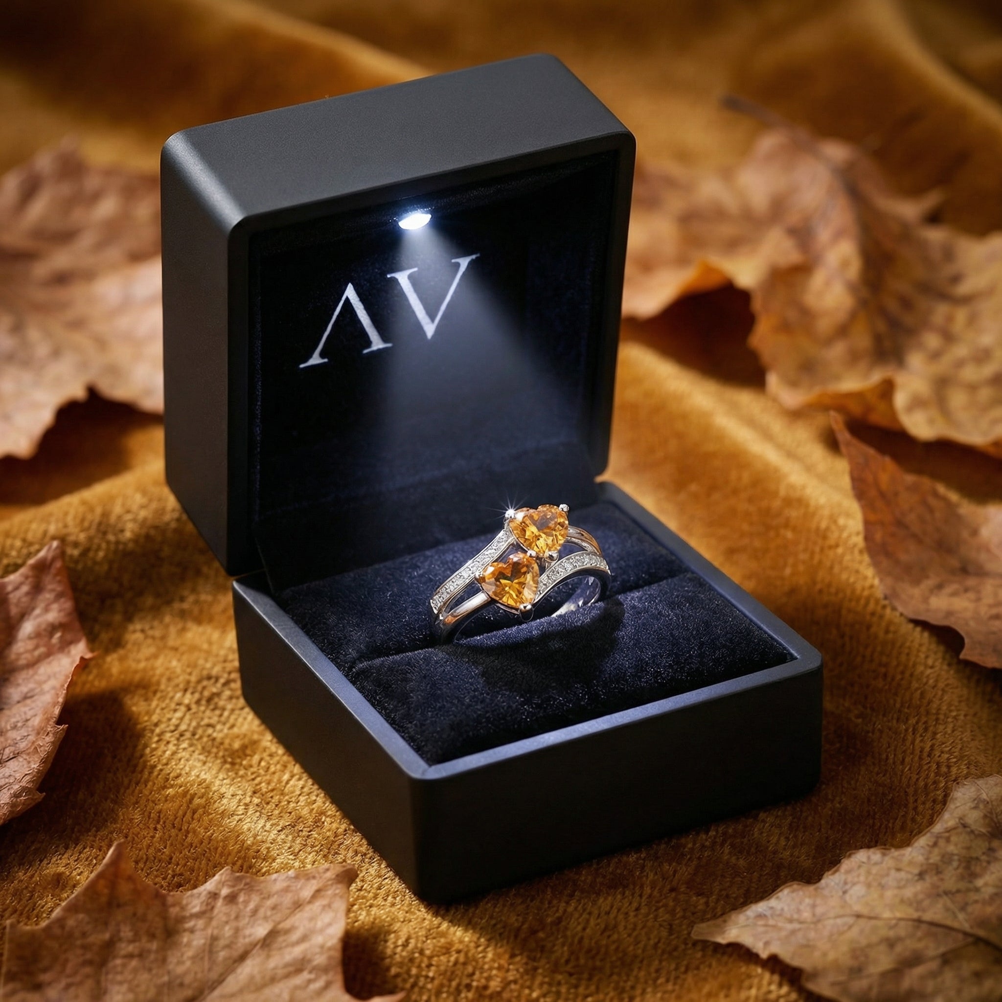 S925 sterling silver Marisara heart ring presented in a black LED-lighted gift box with autumn leaves.
