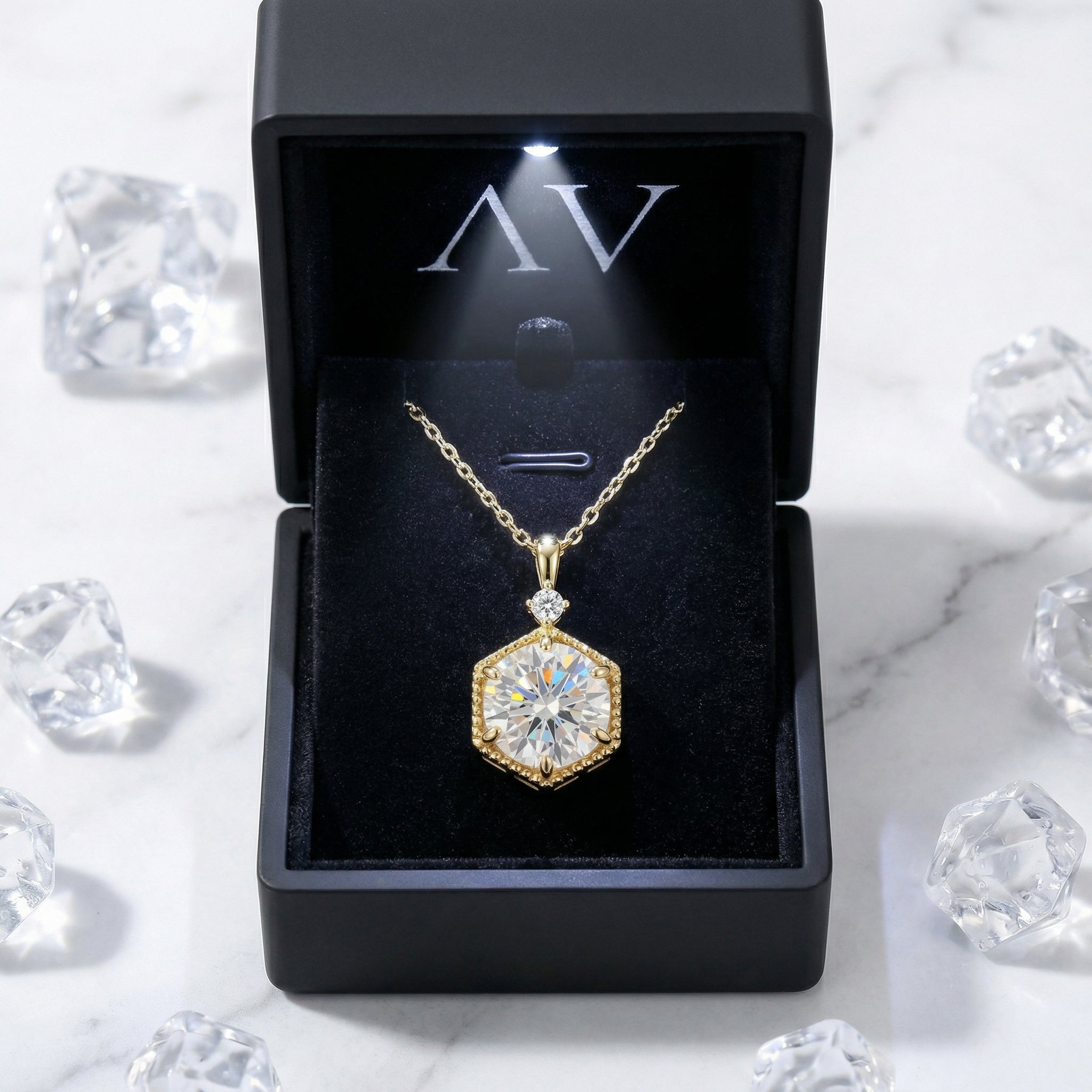 Hexa Radiant 18K gold vermeil necklace with a round simulated diamond in a black LED lighted gift box.