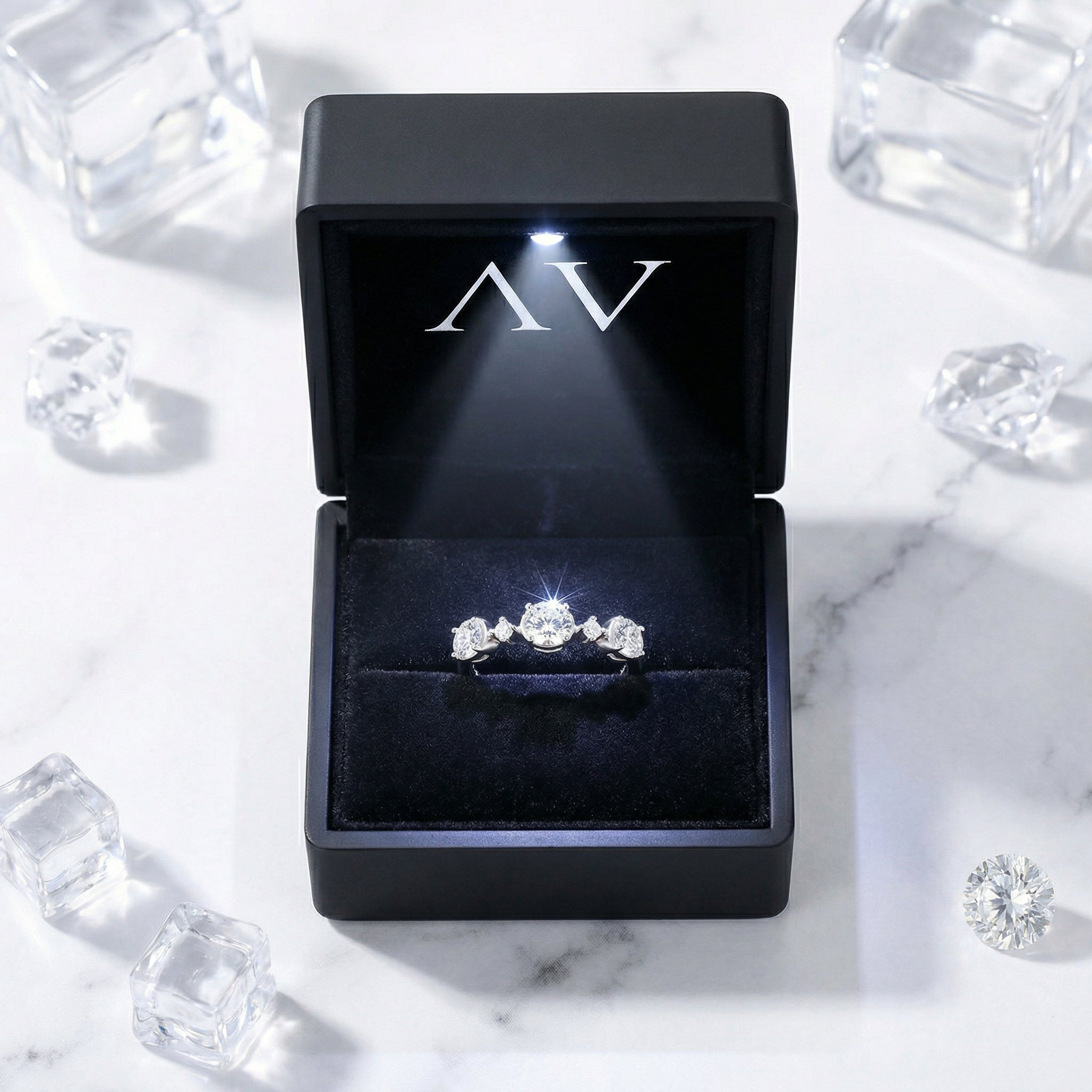Elianne sterling silver zirconia ring presented in a premium black LED-lit gift box on a marble surface.