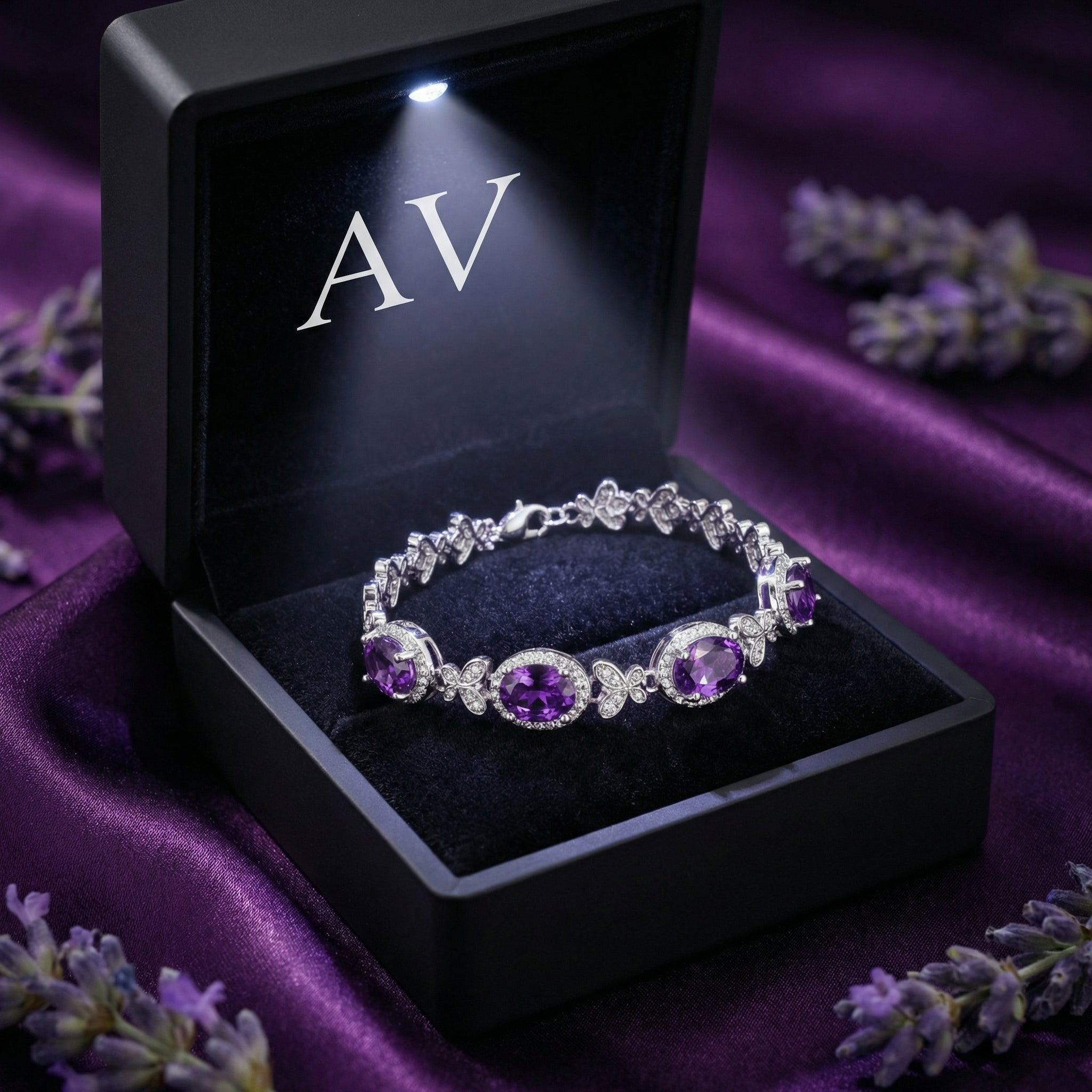 Quintara S925 sterling silver amethyst station bracelet inside a black LED-lit jewelry gift box.