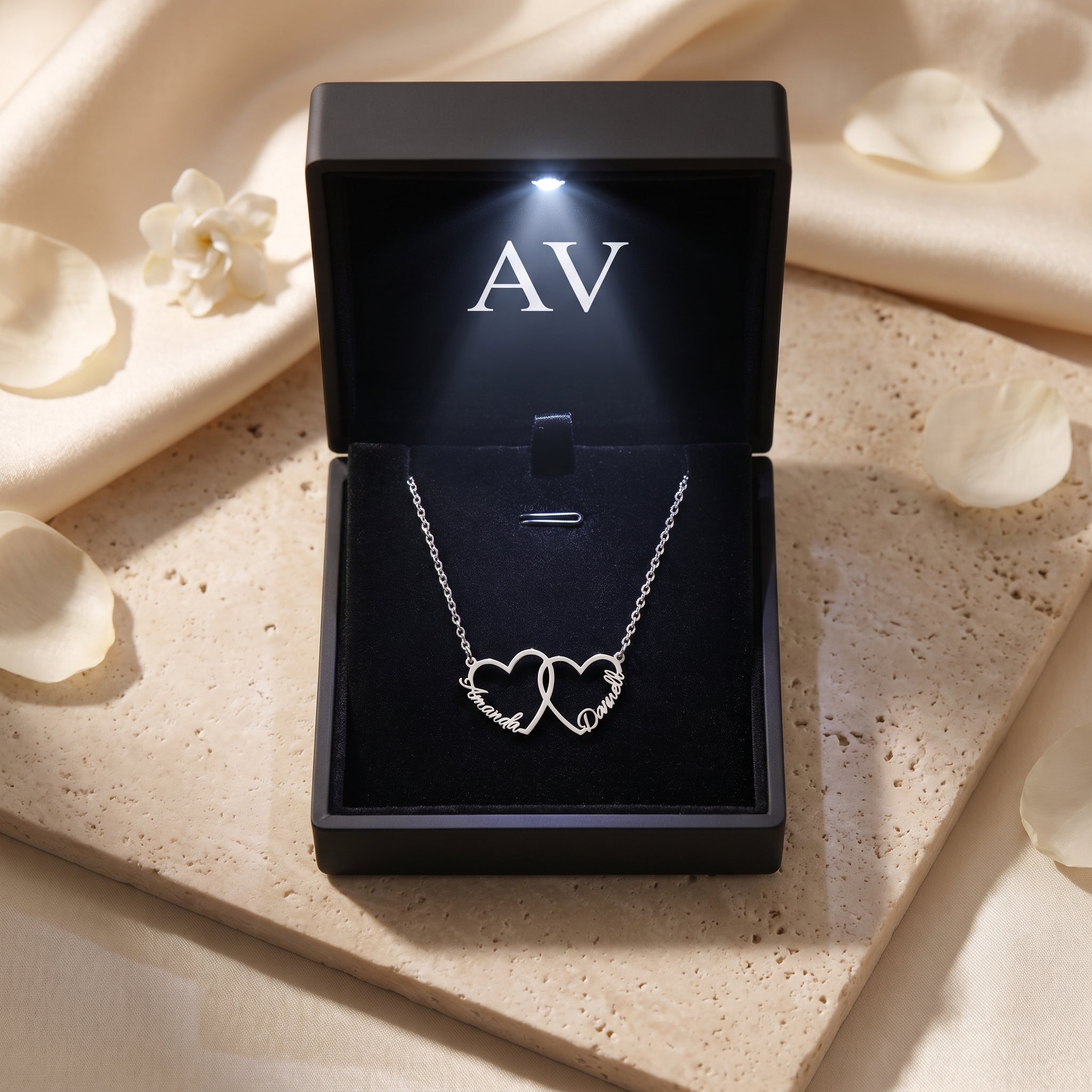 Silver stainless steel interlocking heart necklace in LED gift box.