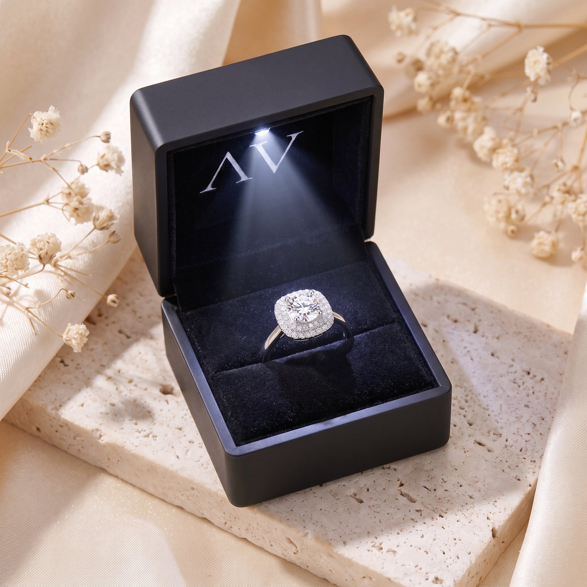 Sterling silver double cushion halo ring presented in a black LED-lit jewelry gift box.